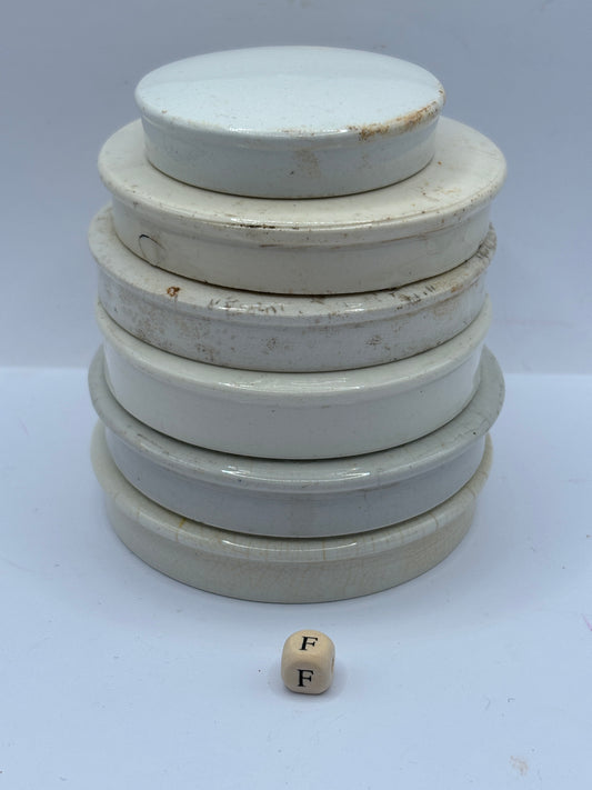 6 old stoneware lids, stackers (F)