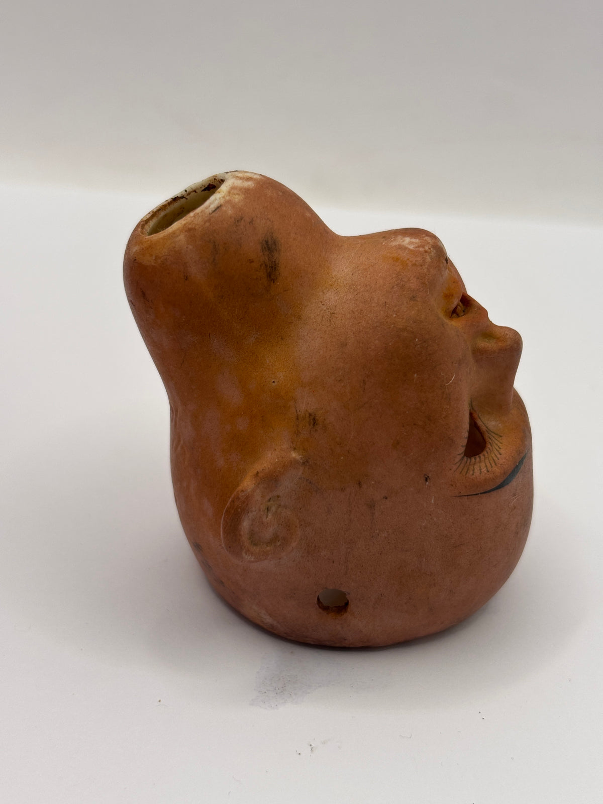 Old bisque dolls head, super stained