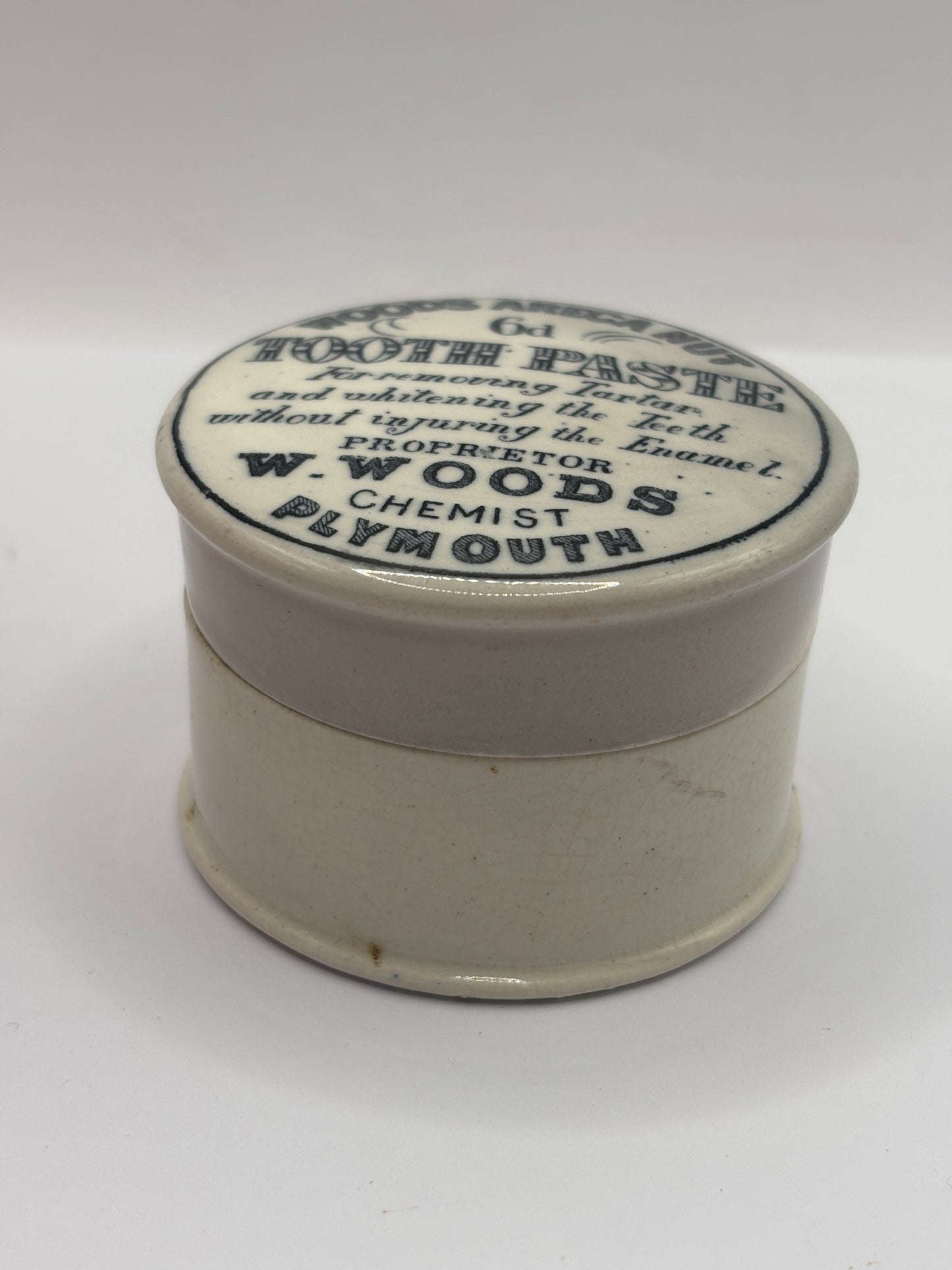 Old advertising lid and base. Woods areca nut tooth paste
