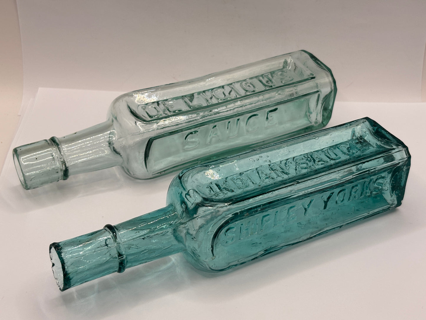 2 old aqua glass sauce bottles, Grannys & indian sauce