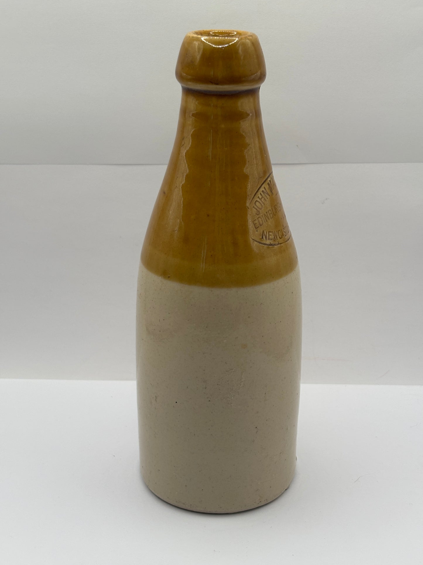 Old stoneware stout bottle, John Mackay & Co