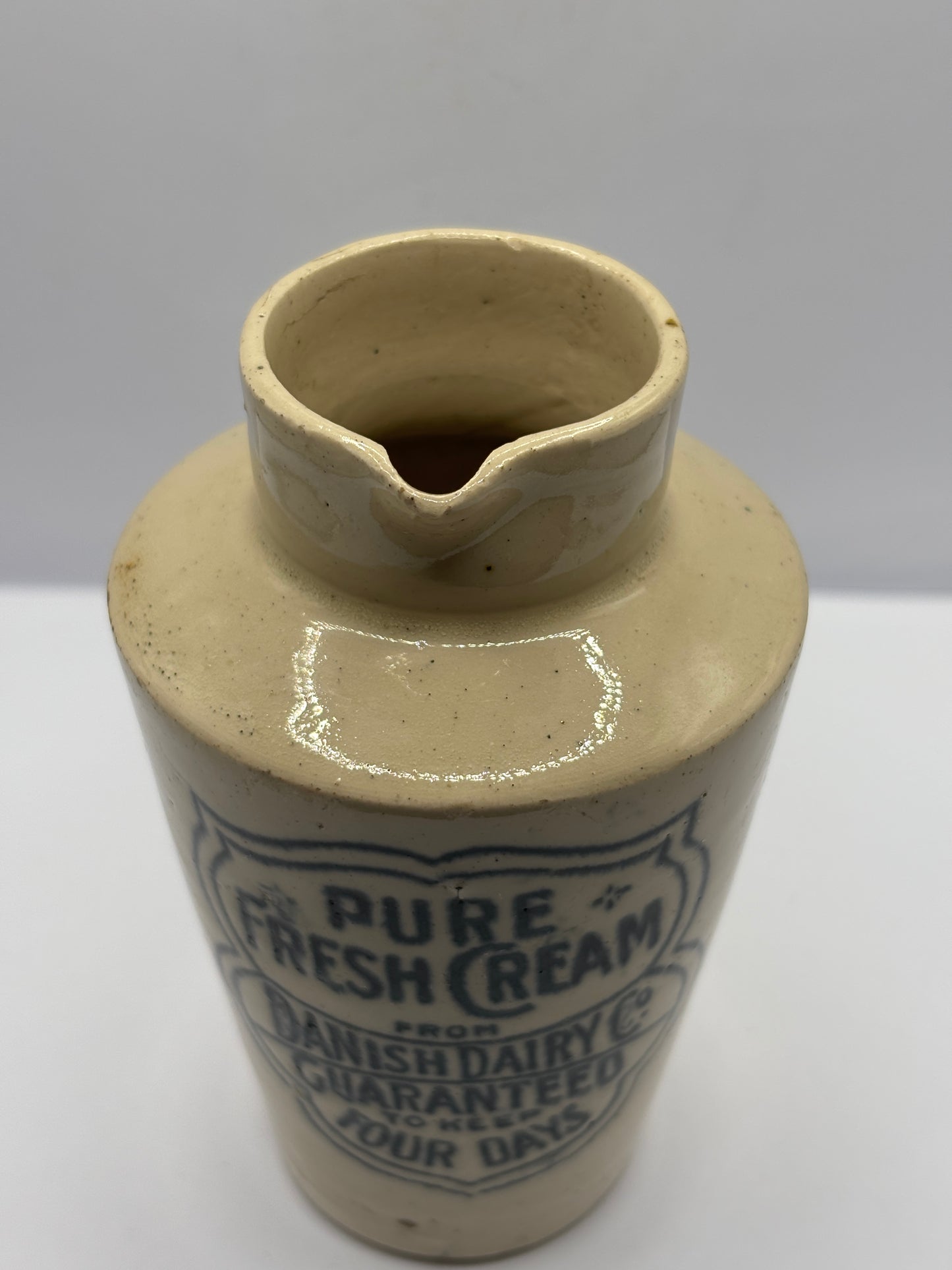 Old stoneware advertising cream pot, Pure fresh cream, Danish dairy co. Damaged
