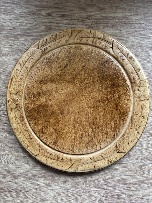 Old wooden carved bread board