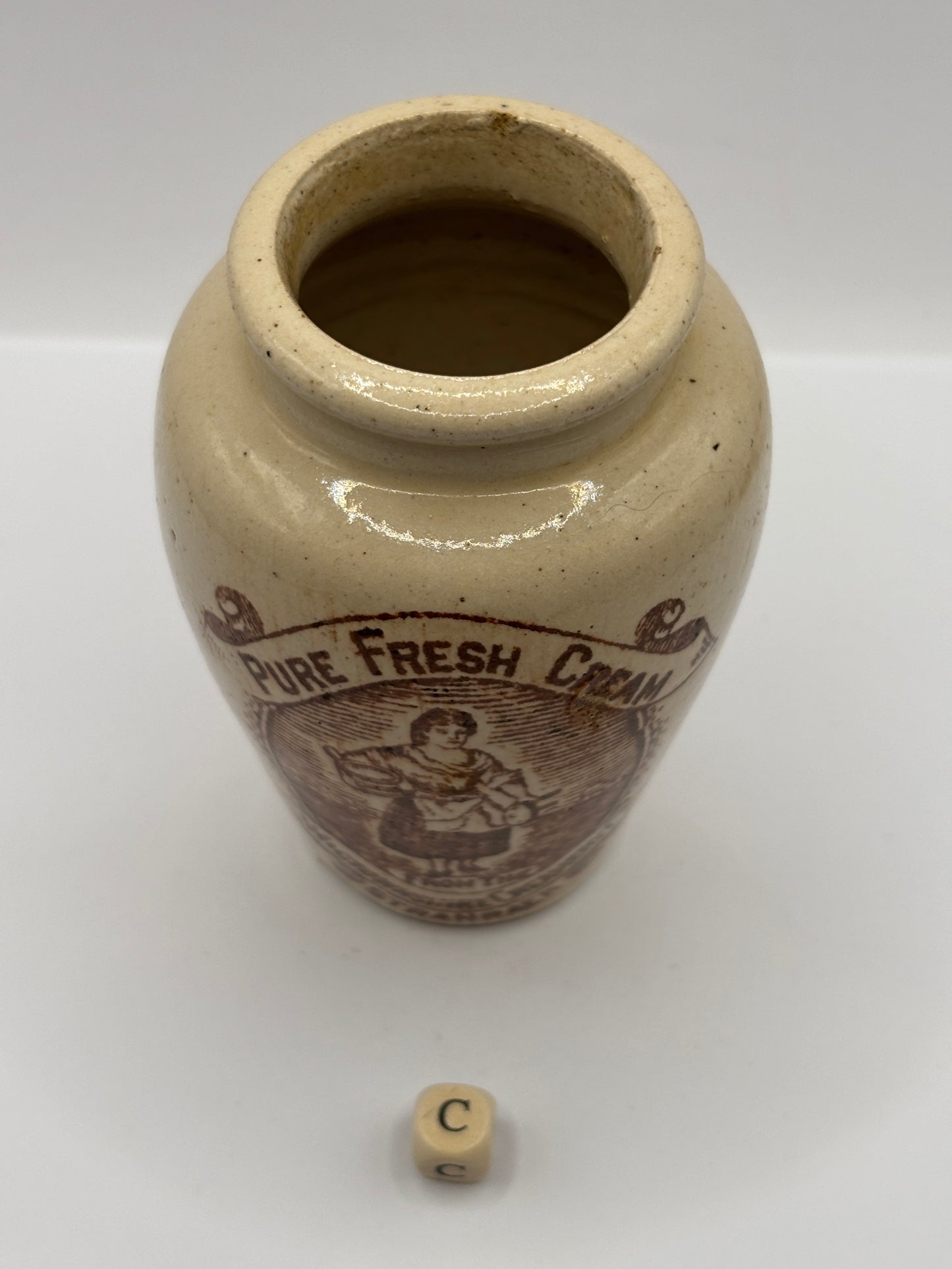 Old stoneware advertising cream pot, pure fresh cream Stranraer. Serpia print (C) milk maid