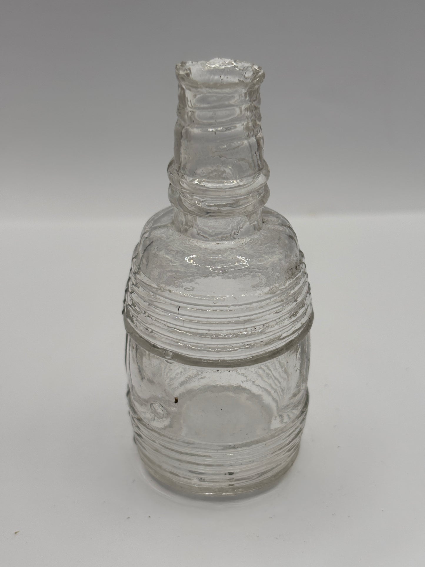 Old clear glass barrel ink bottle, inkwell