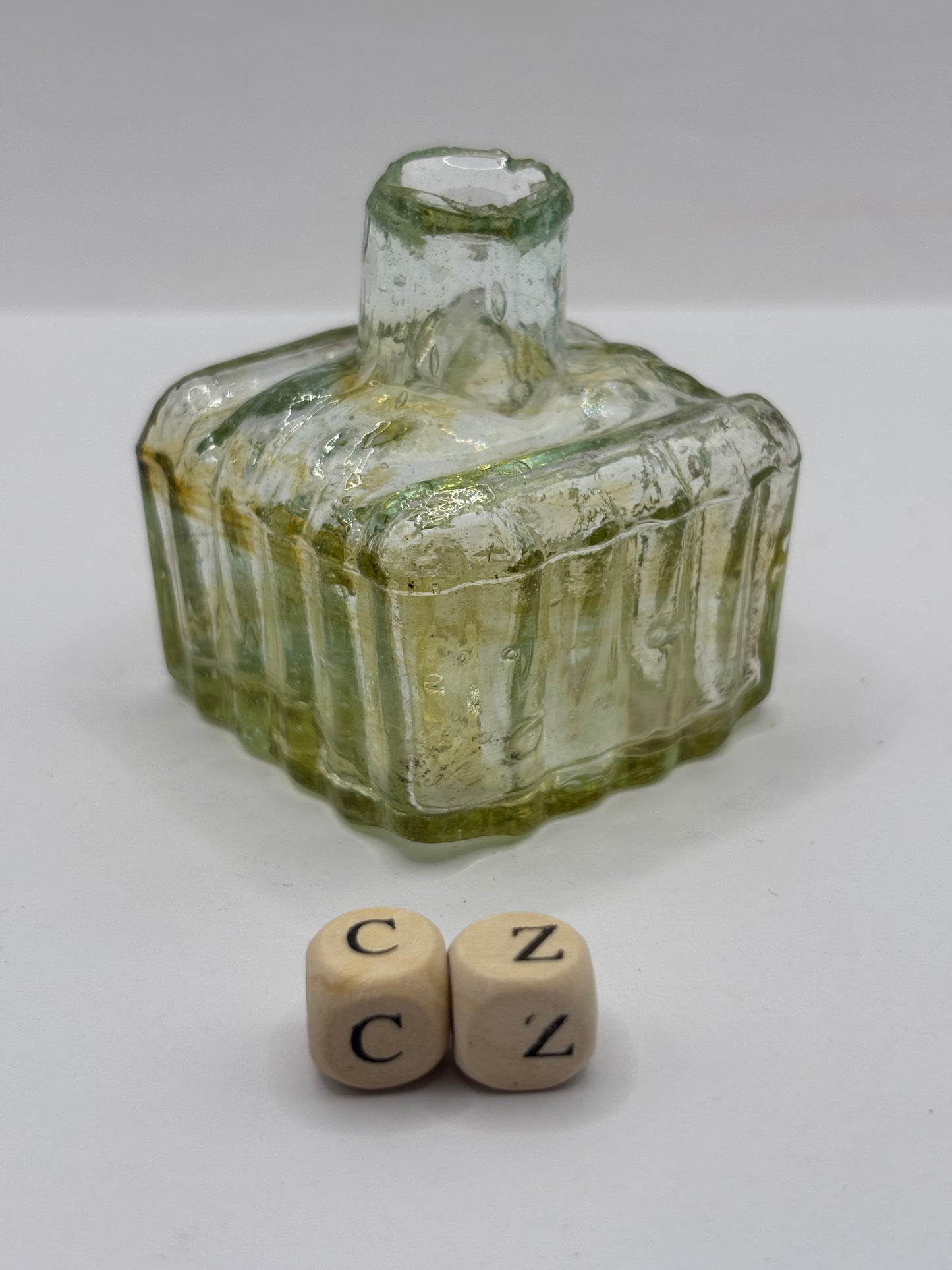 Old glass inkwell with swirls, penny ink, ink bottle (cz)