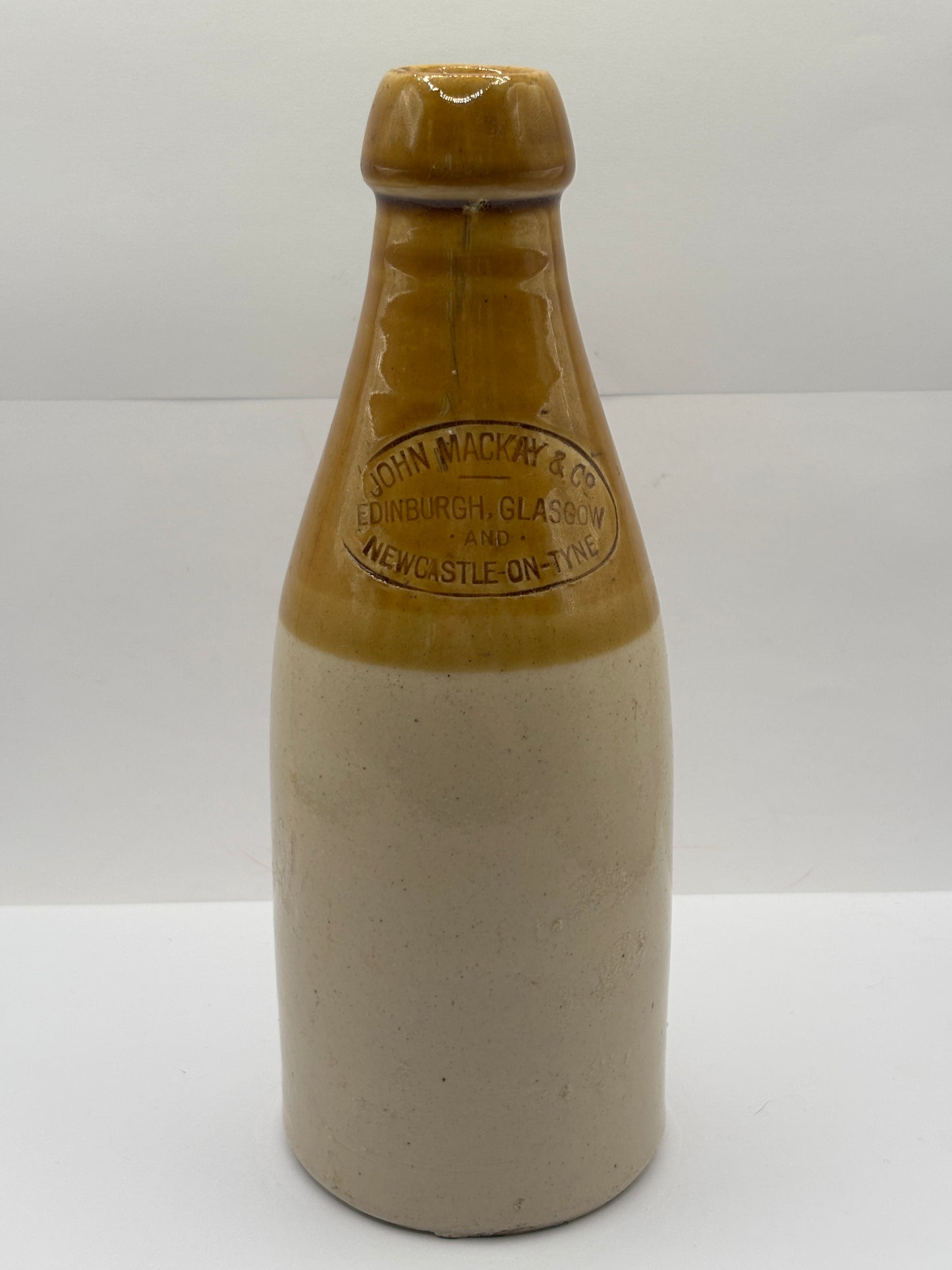 Old stoneware stout bottle, John Mackay & Co