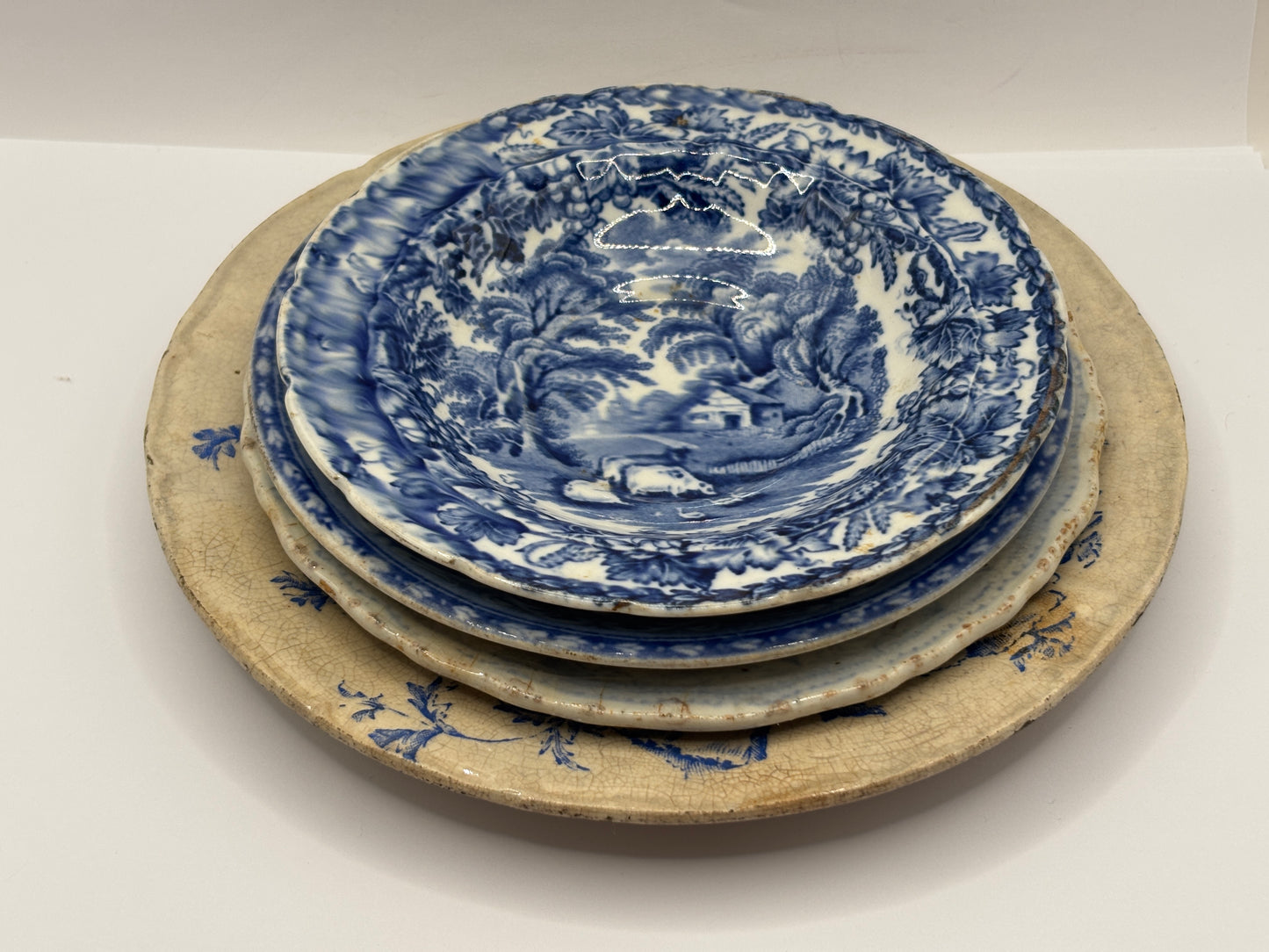 4 old blue and white transferred stoneware plates