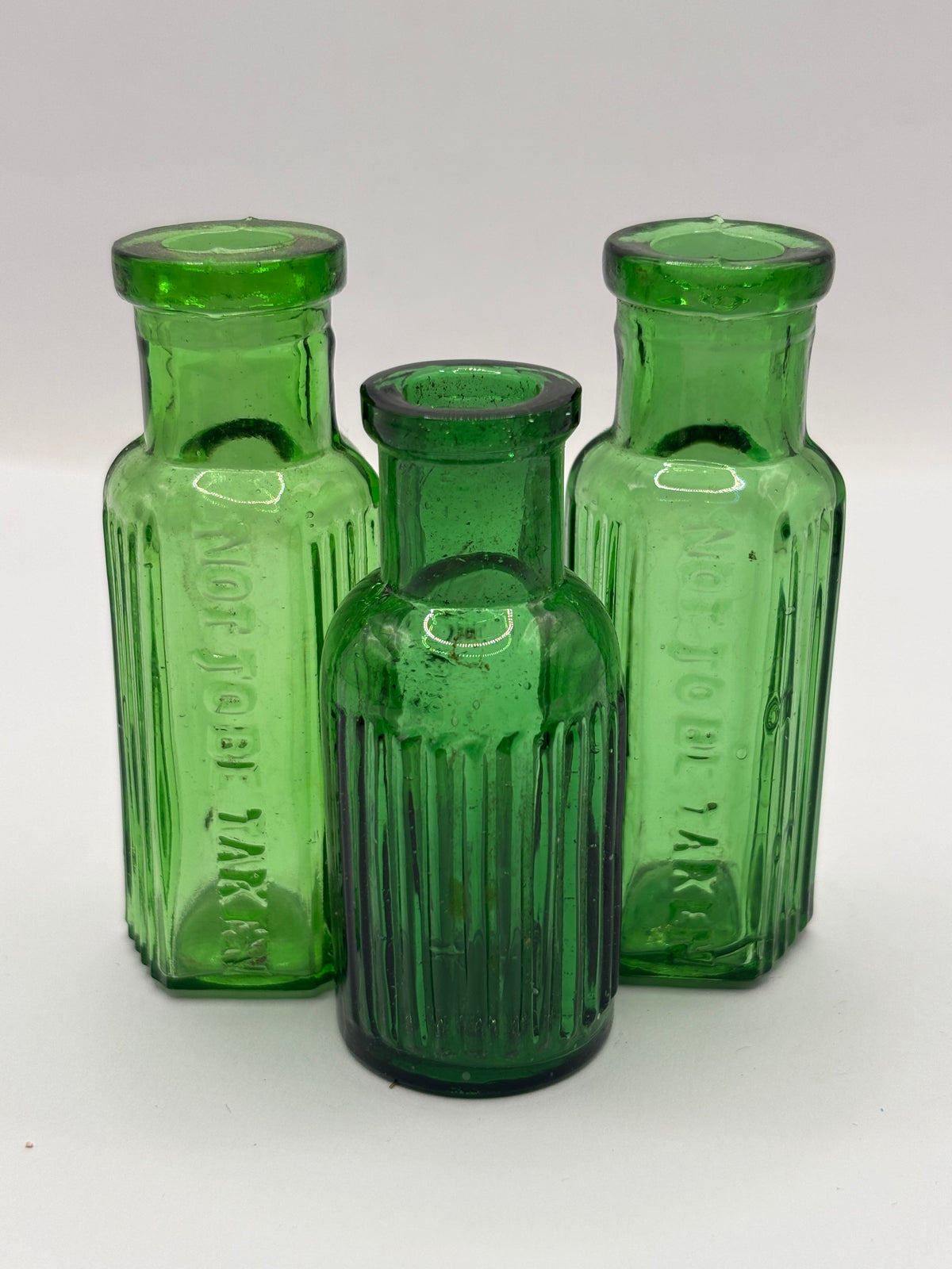 3 old small green ribbed poison bottles, not to be taken