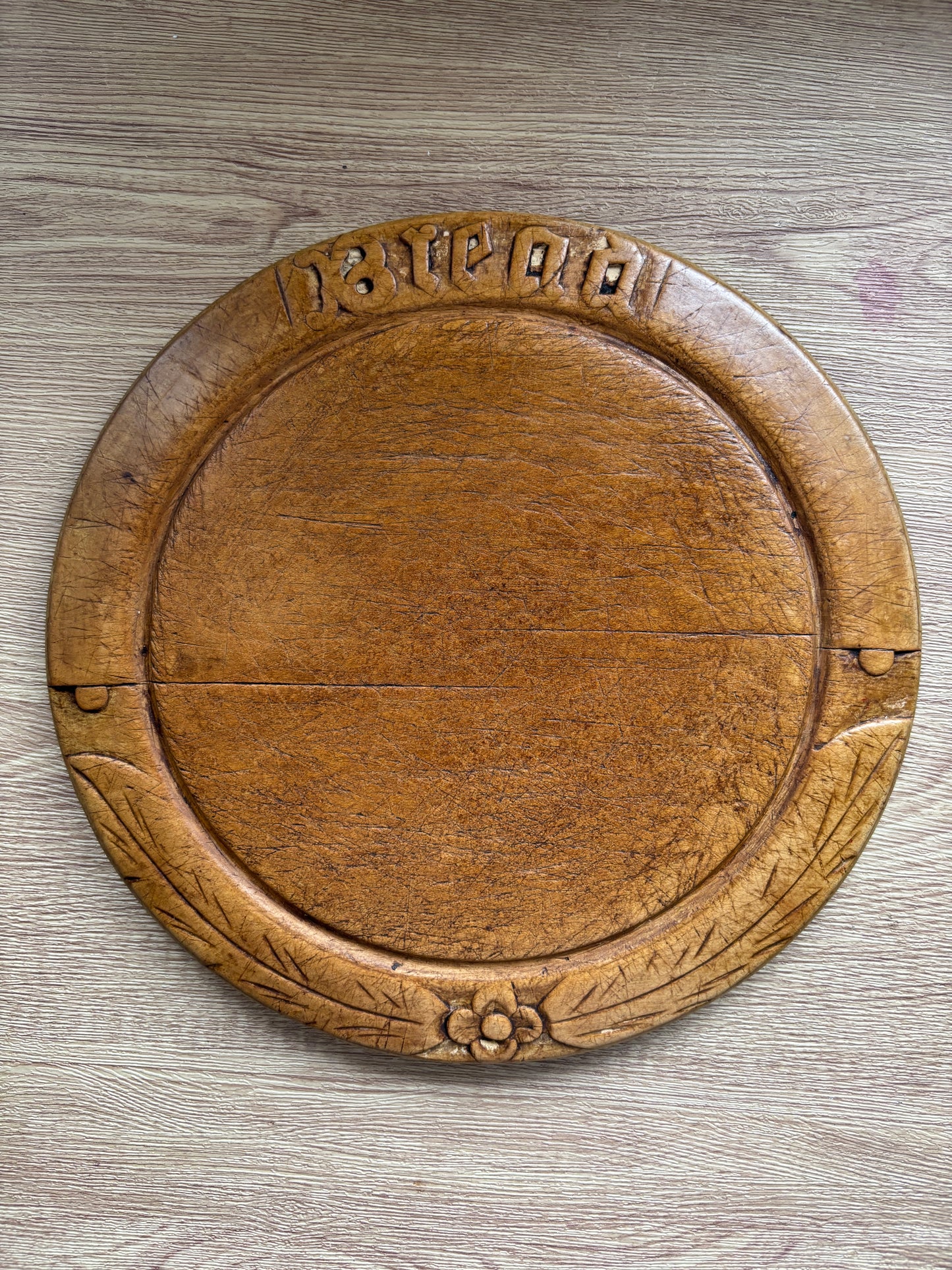 Old wooden carved bread board