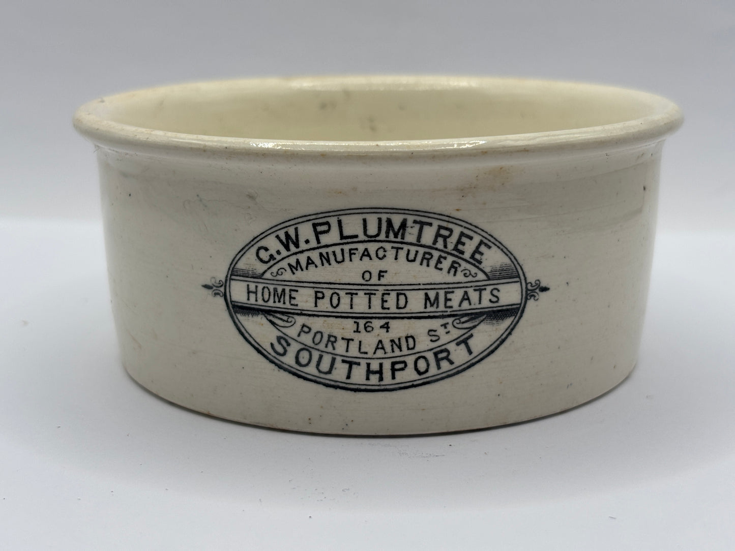 Old XL advertising meat paste pot, Plumtrees