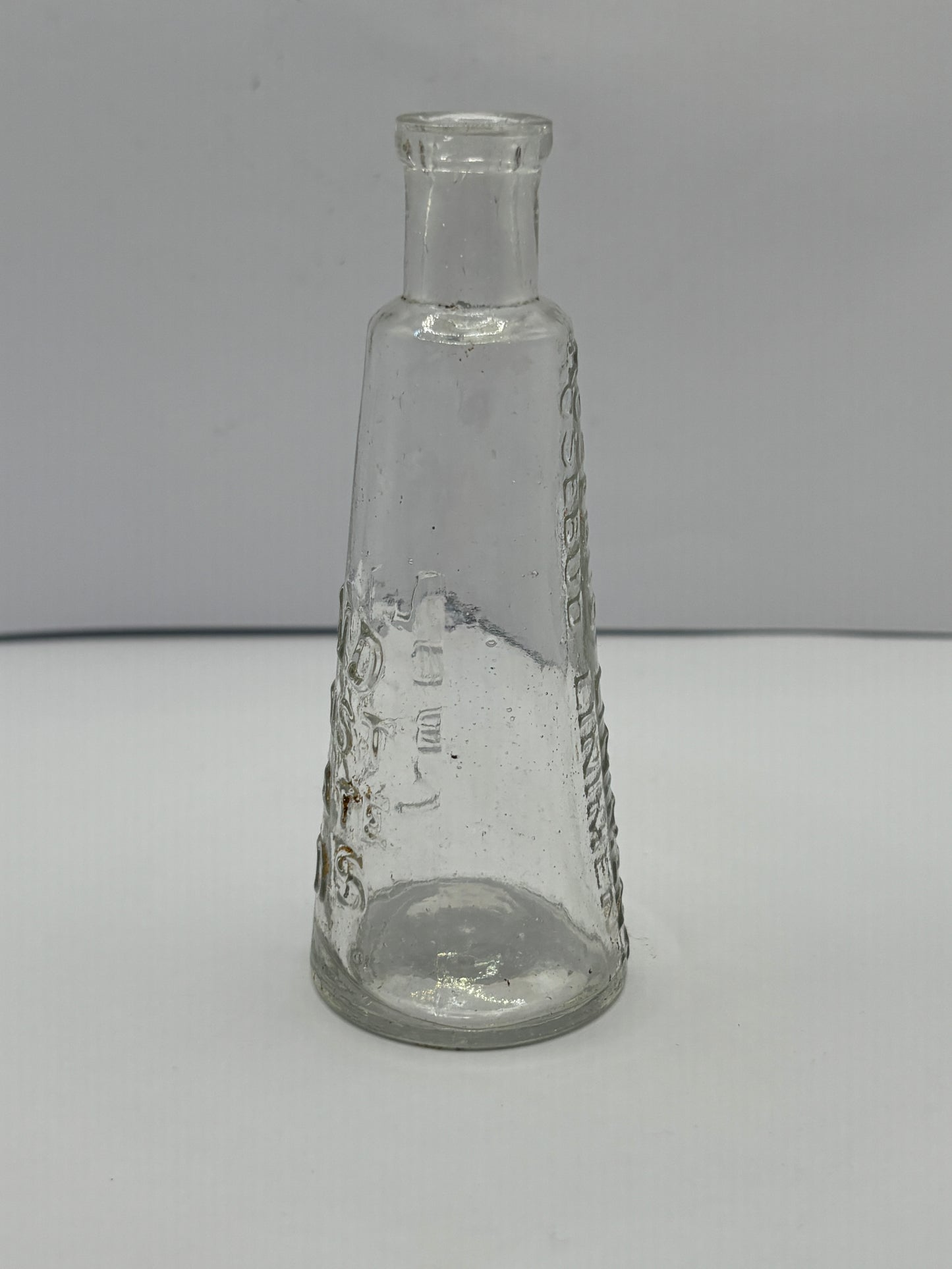 Old Leeds Rosebud liniment advertising bottle, Land chemist Briggate Leeds