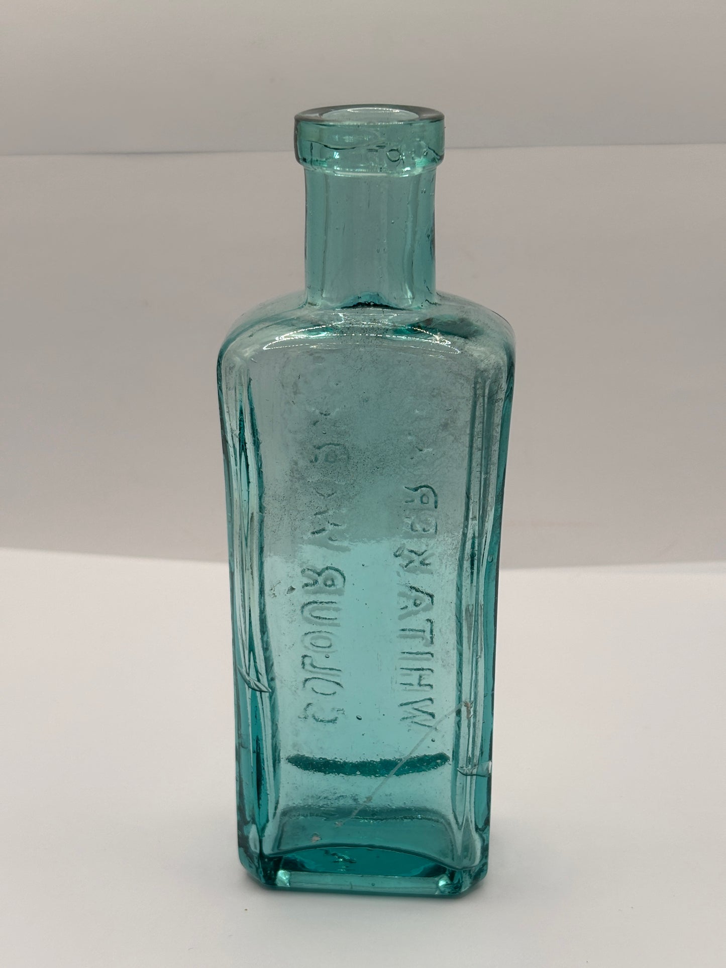 Old advertising aqua glass chemist bottle, Whittakers colour works
