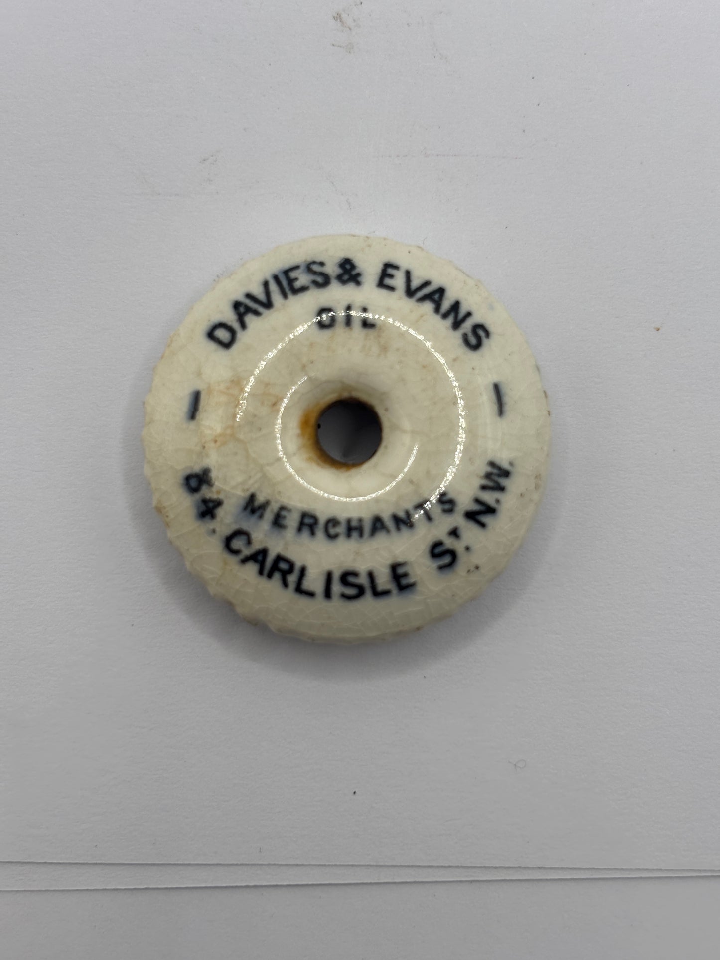 Small advertising lid, oil lid? Davies & evans oil merchants