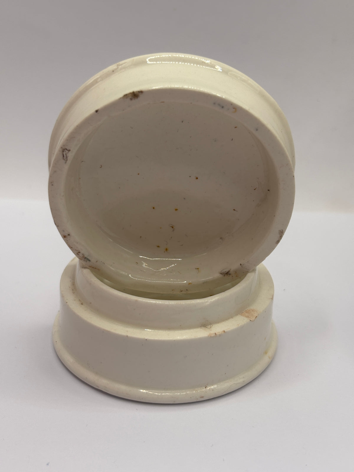 Old advertising lid and base. Woods areca nut tooth paste. Damaged