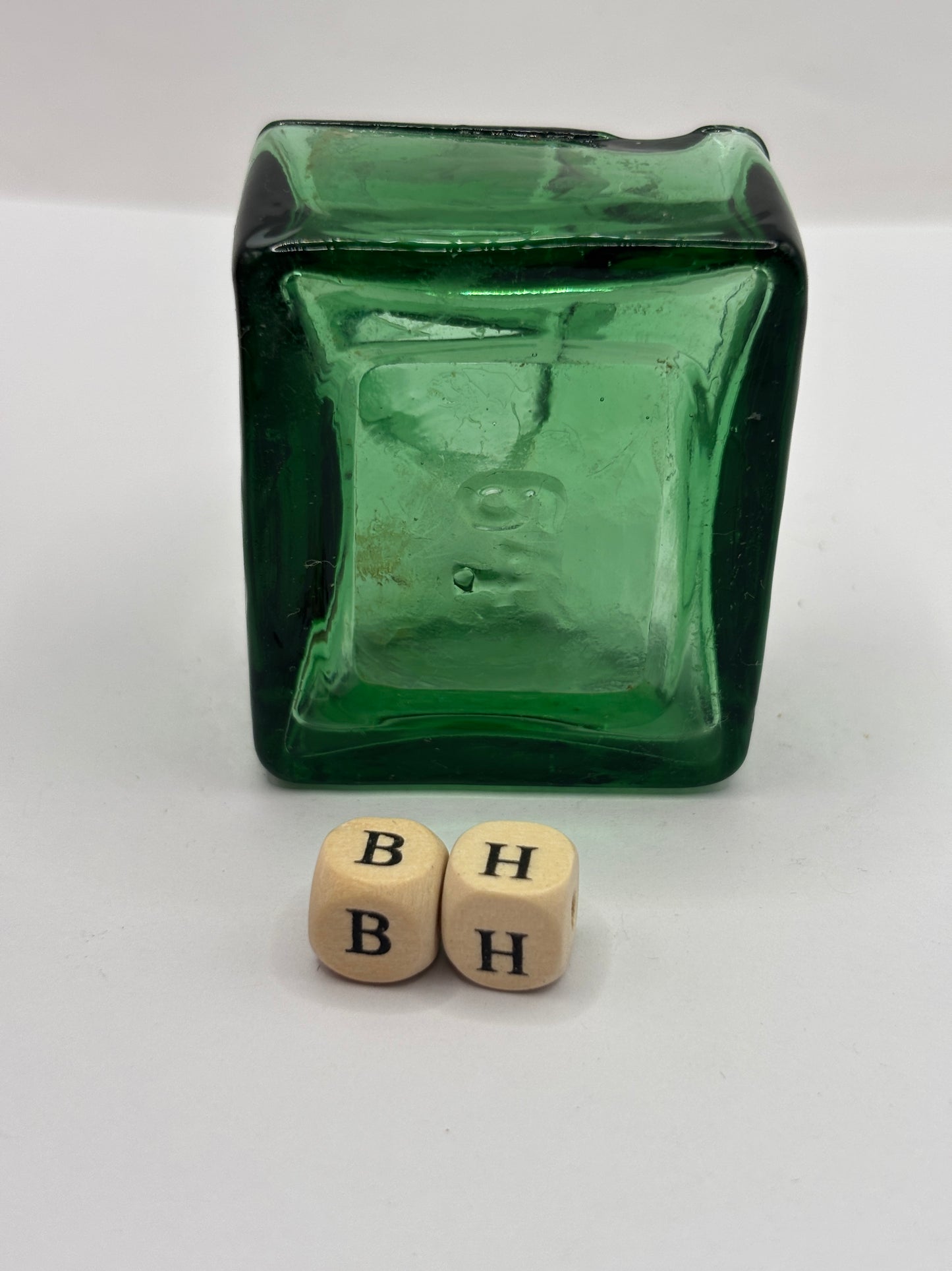 Old green glass ink bottle, inkwell. With pen rest (BH) chipped