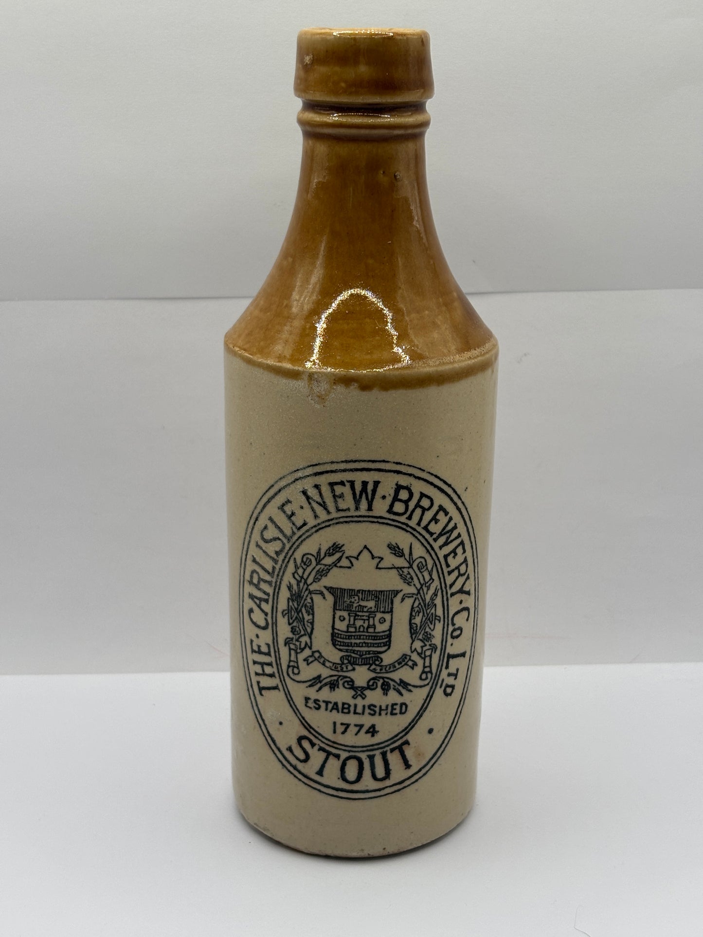 Old stoneware stout bottle, The Carlisle new brewery