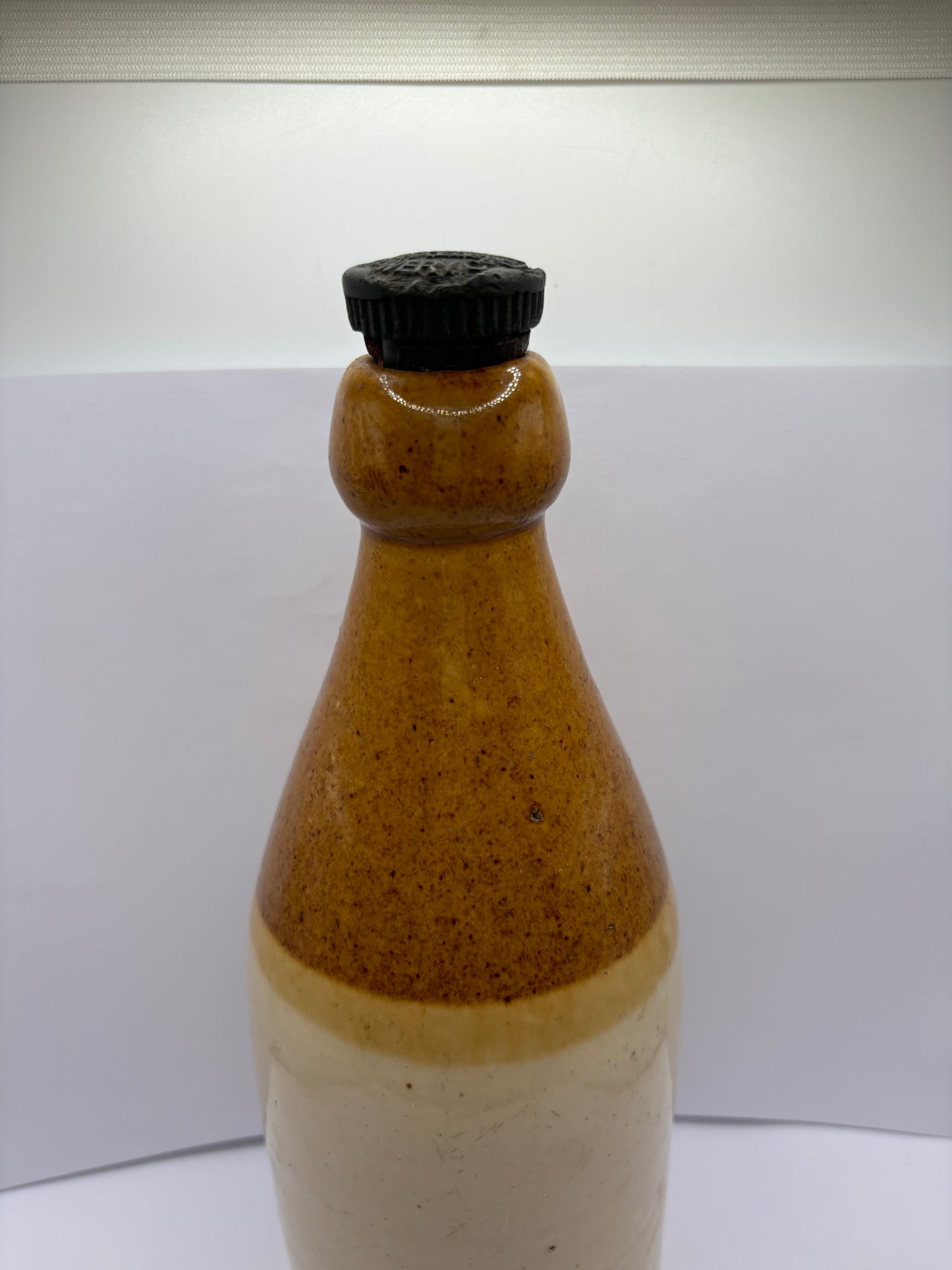 Large plain stoneware ginger beer bottle (a)