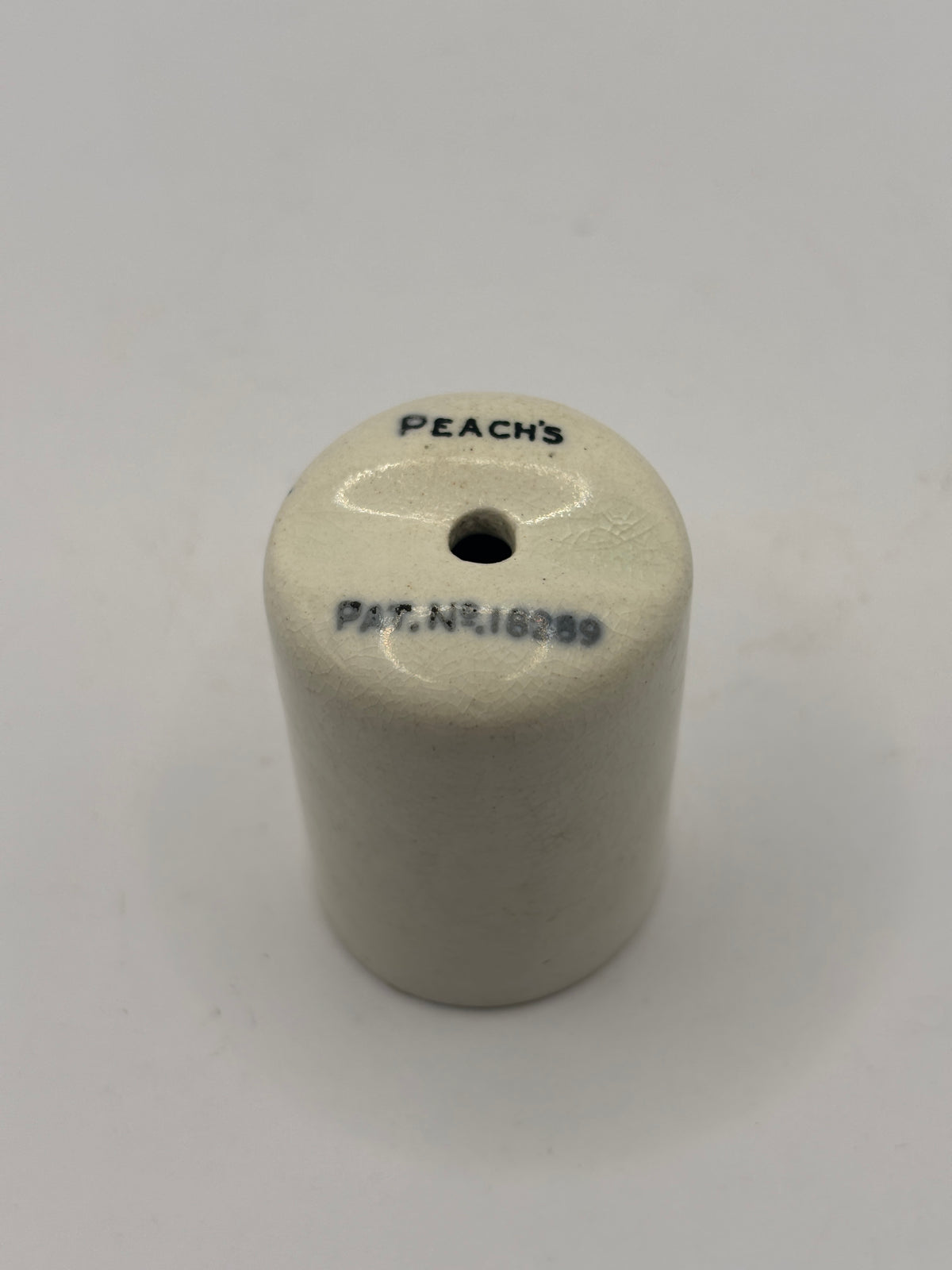 Old small stoneware peach’s mustard dispenser