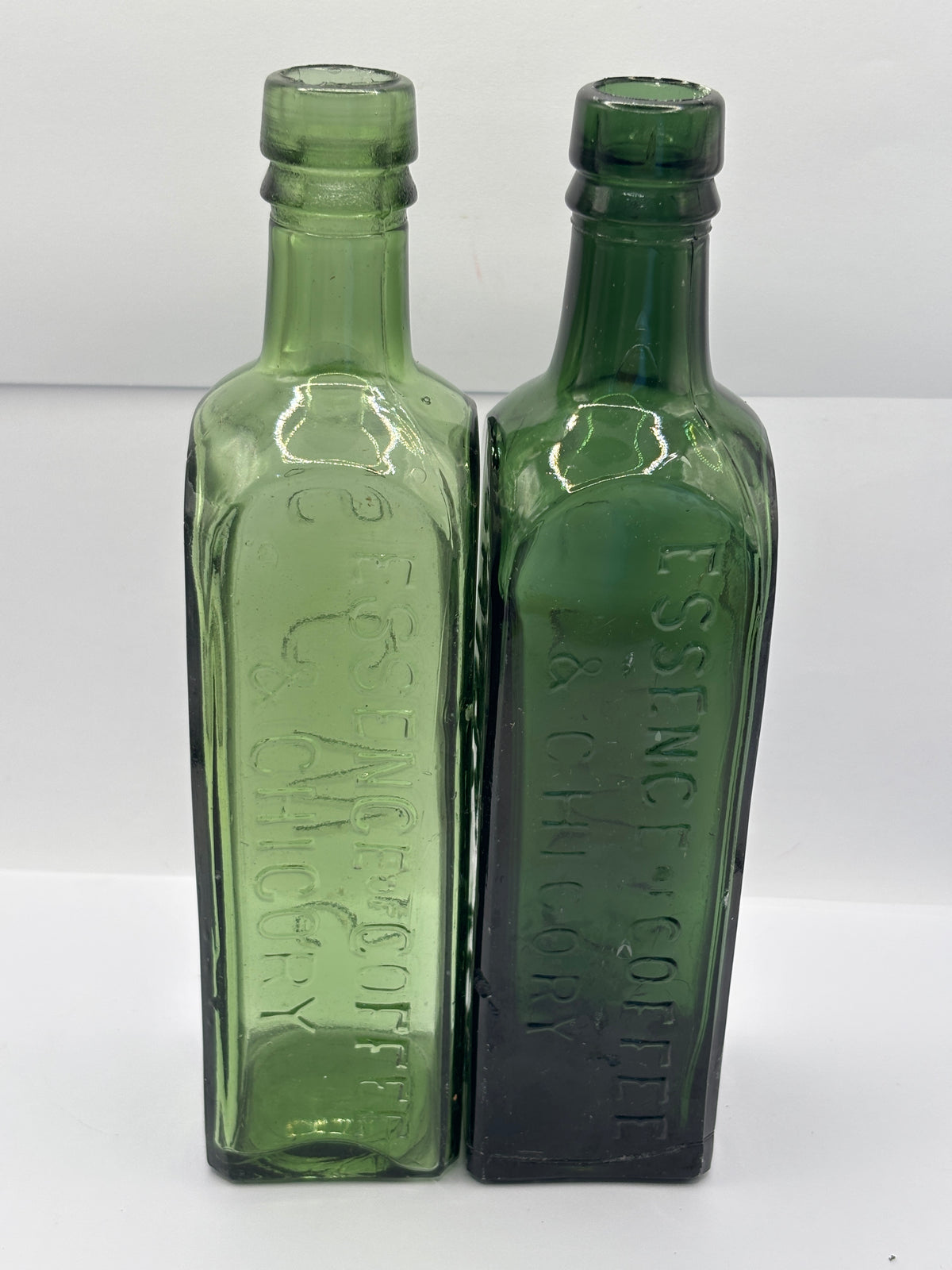 2 Old green glass essence of coffee & chicory bottles