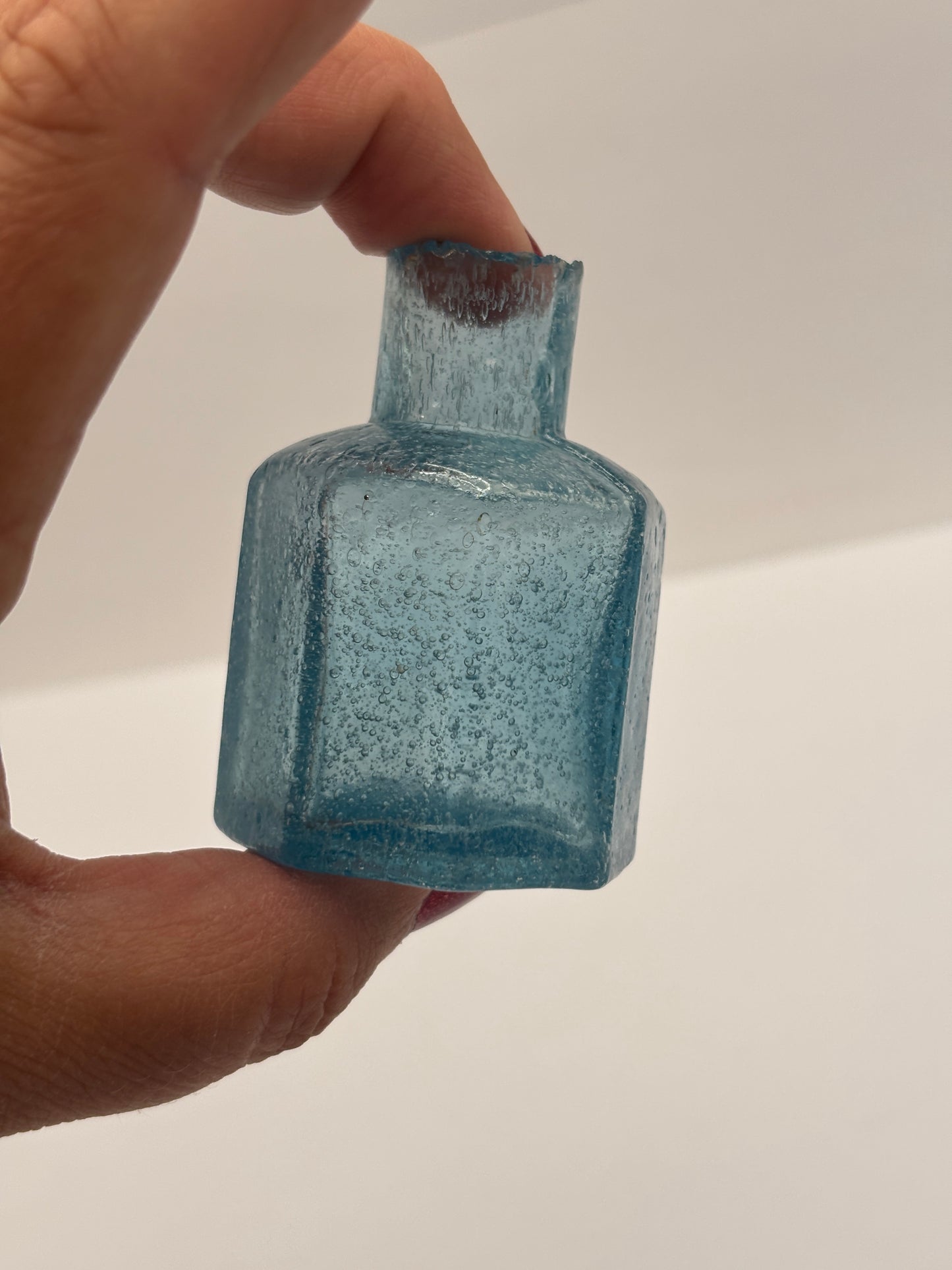 Old blue glass inkwell, ink bottle, penny ink. Lots of air bubbles
