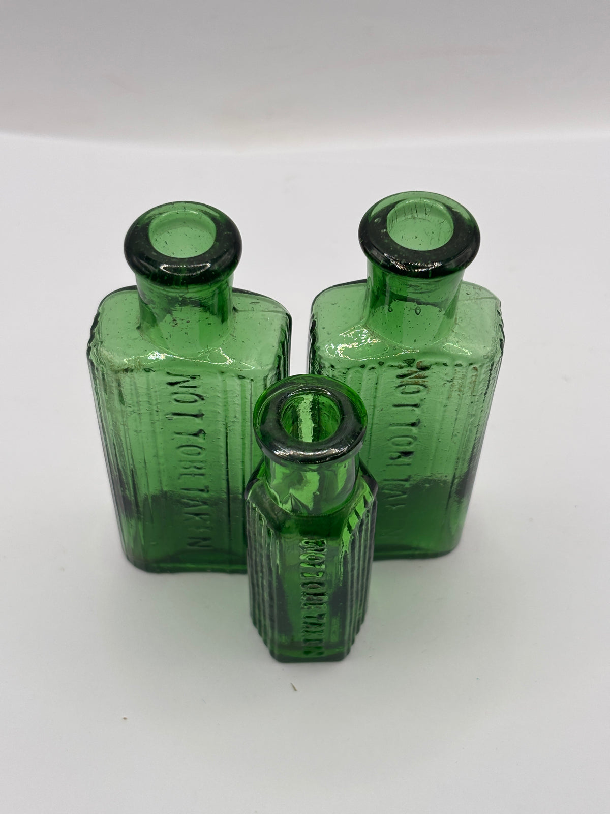 3 old small green ribbed poison bottles, not to be taken