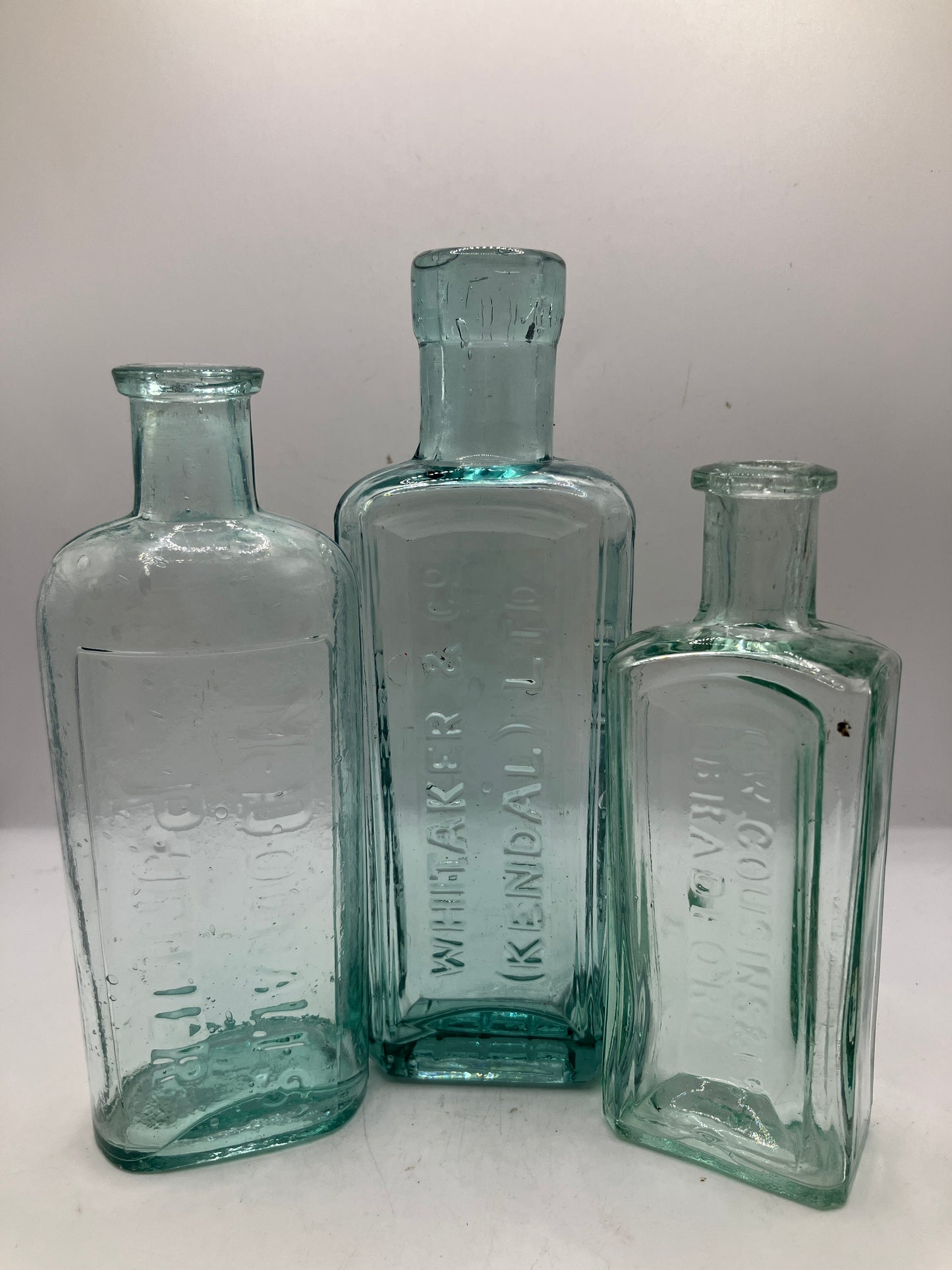 3 advertising chemist bottles