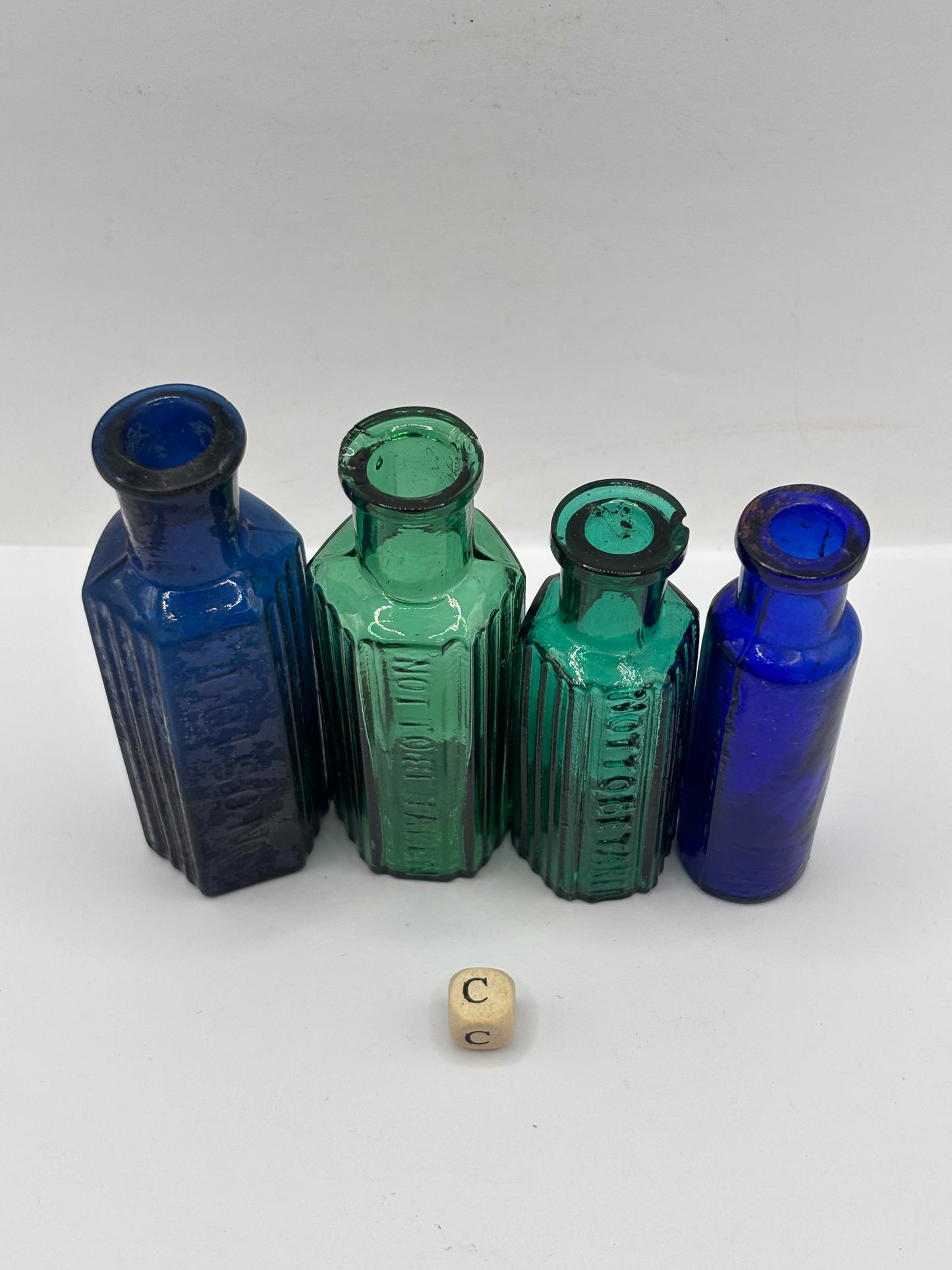 4 old glass poison bottles, chipped (C)