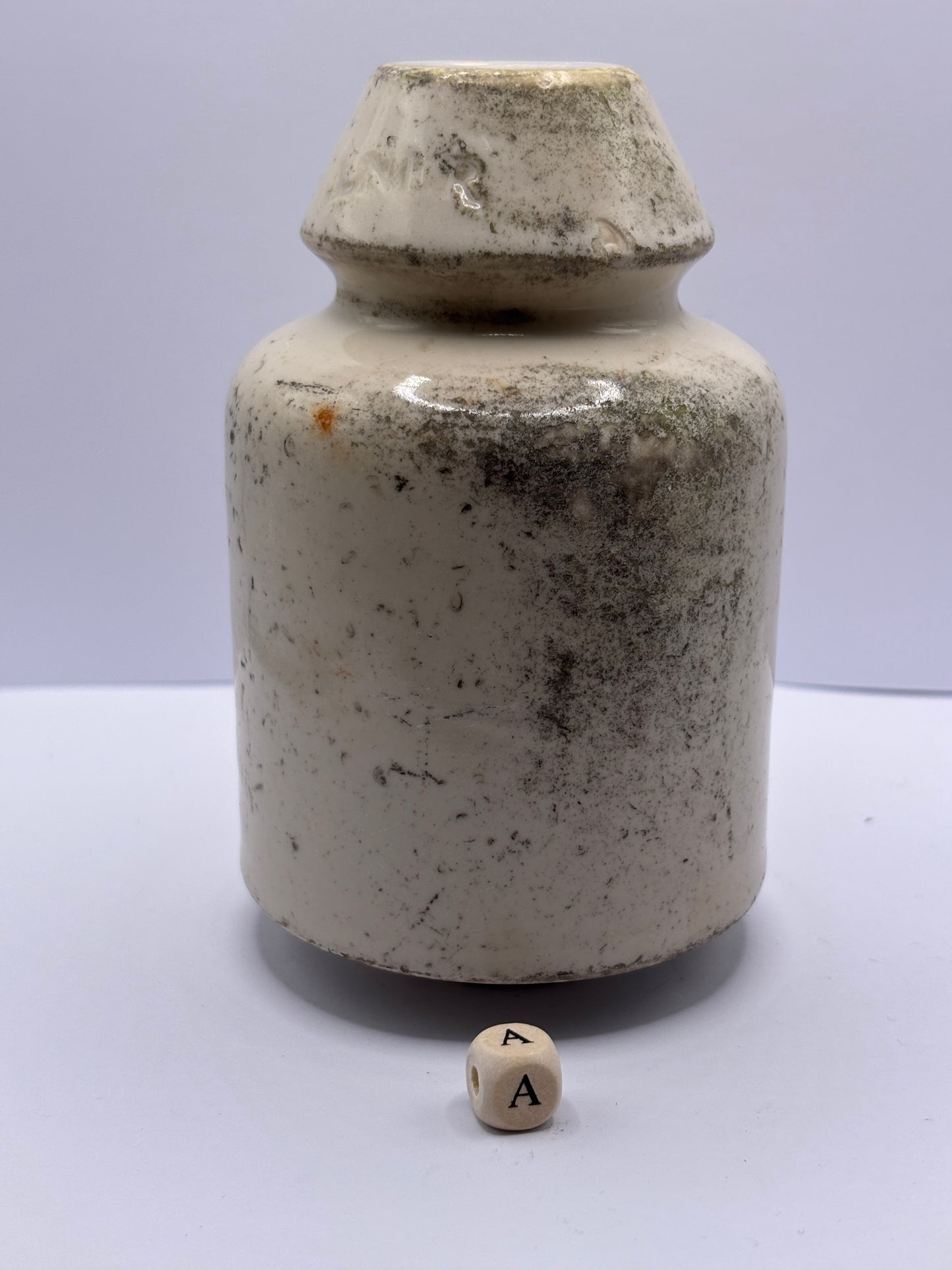 Old stoneware telegraph pole insulator (a)