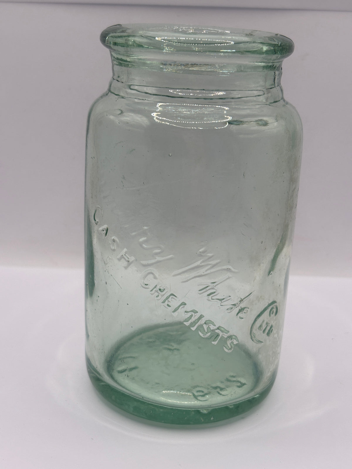 Old advertising aqua glass jar, Timothy Whites cash chemists