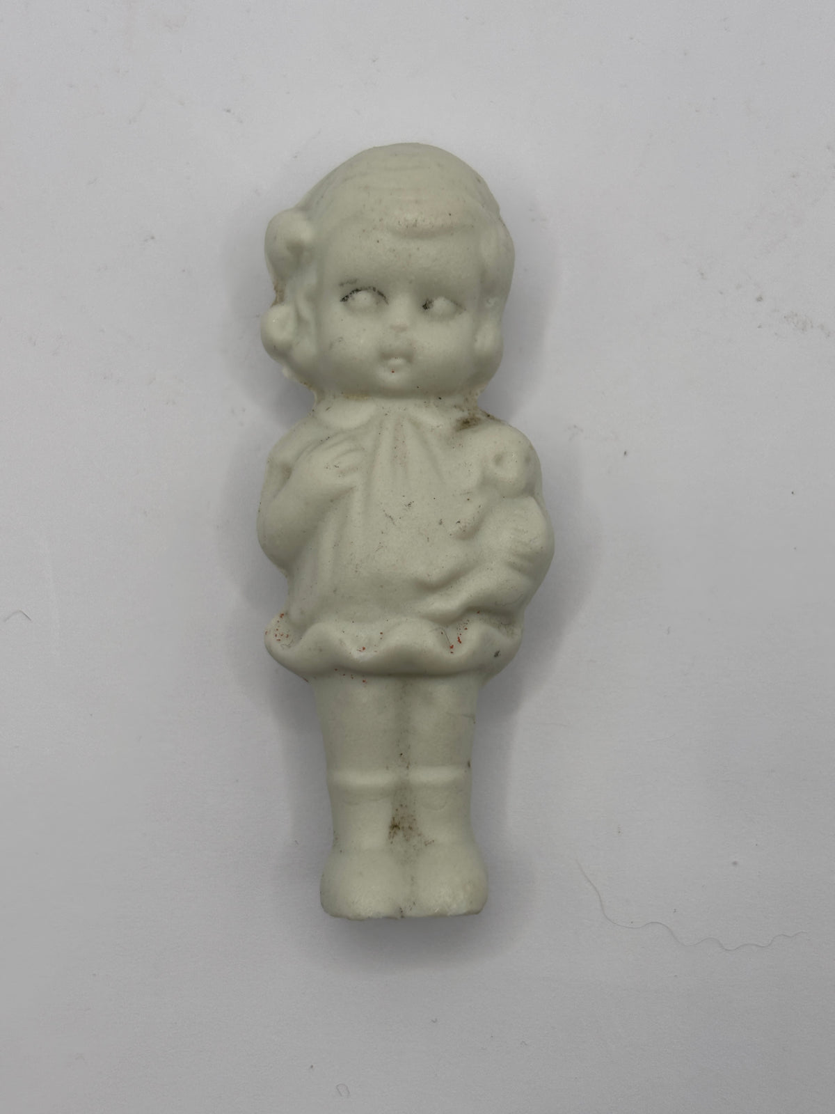 Old mini stoneware doll