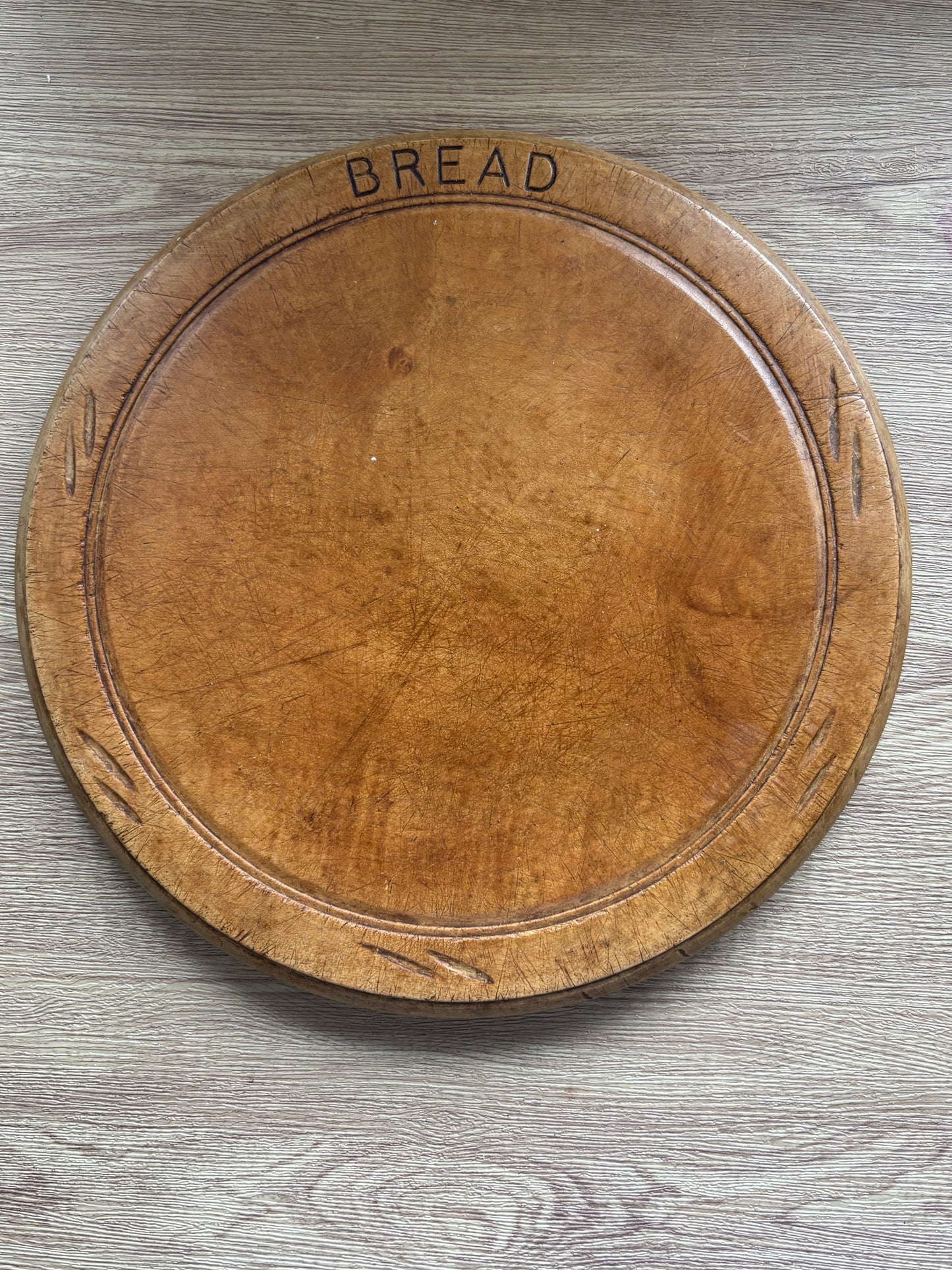 Old wooden carved bread board
