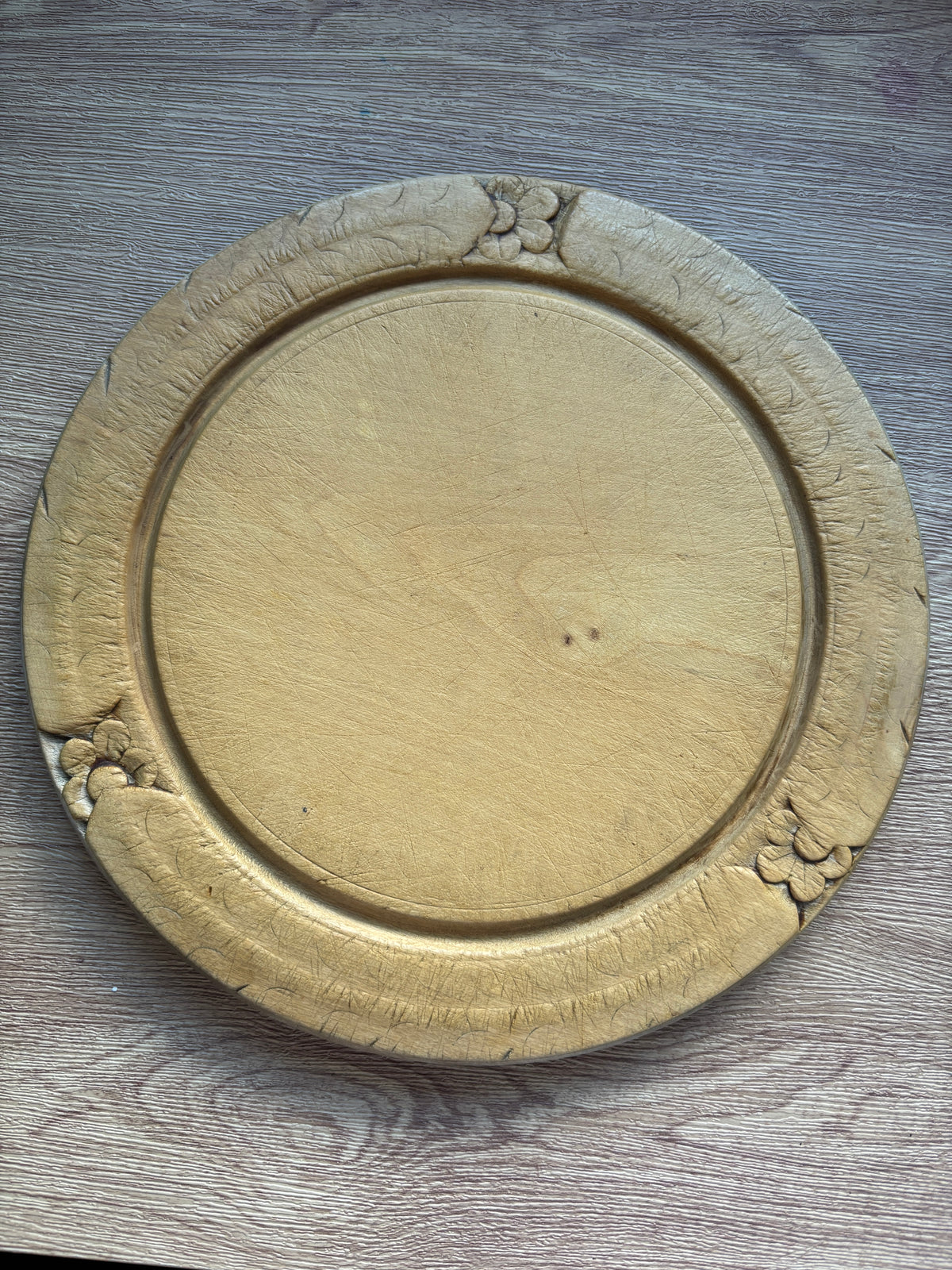 Old wooden carved bread board