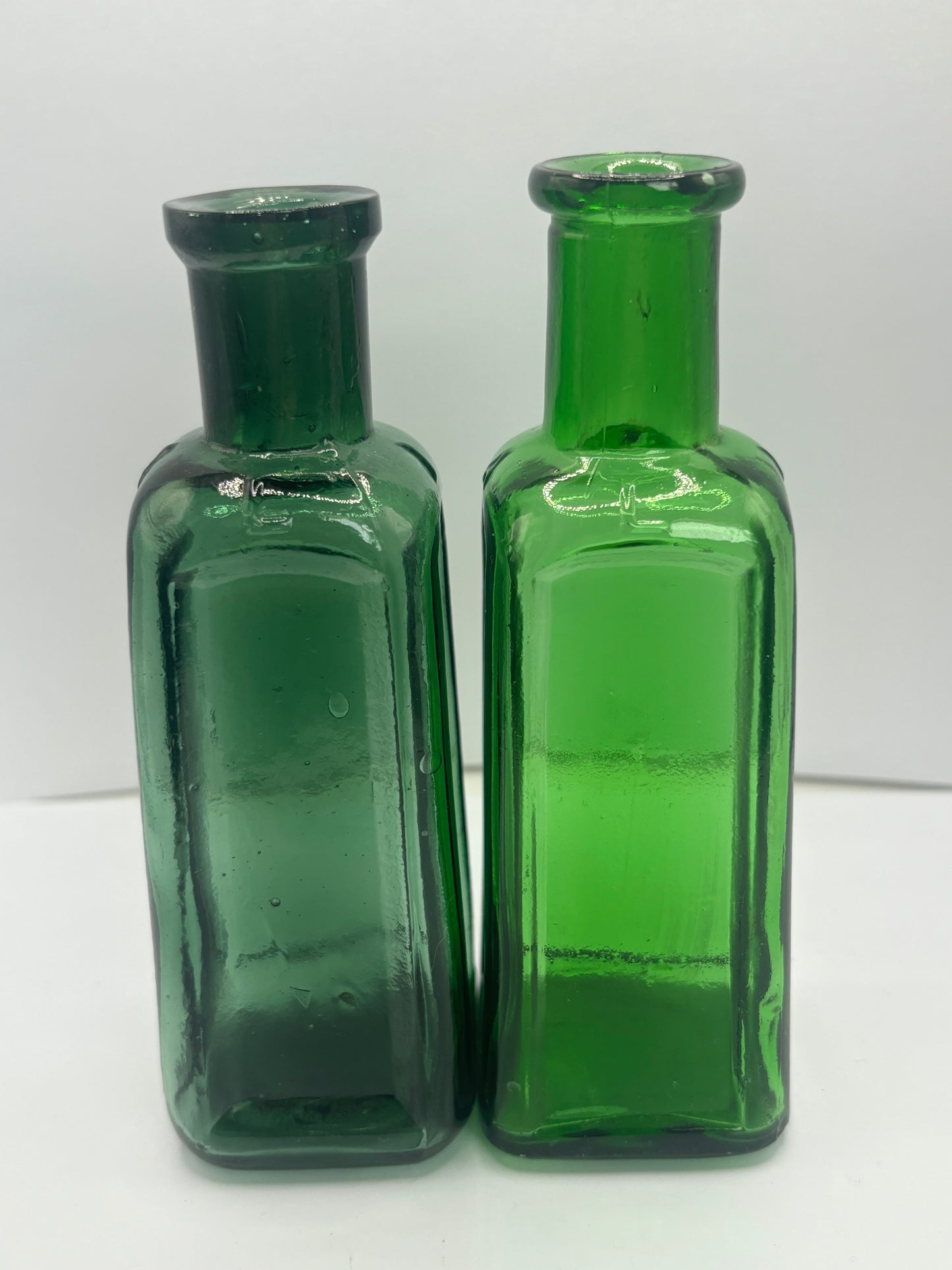 2 old green Izal bottles