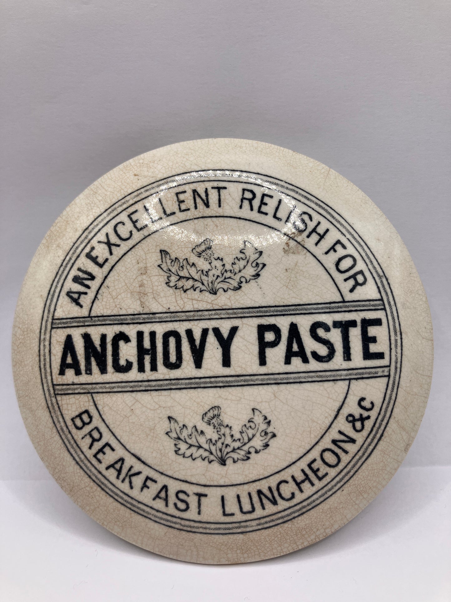 Anchovy paste advertising lid