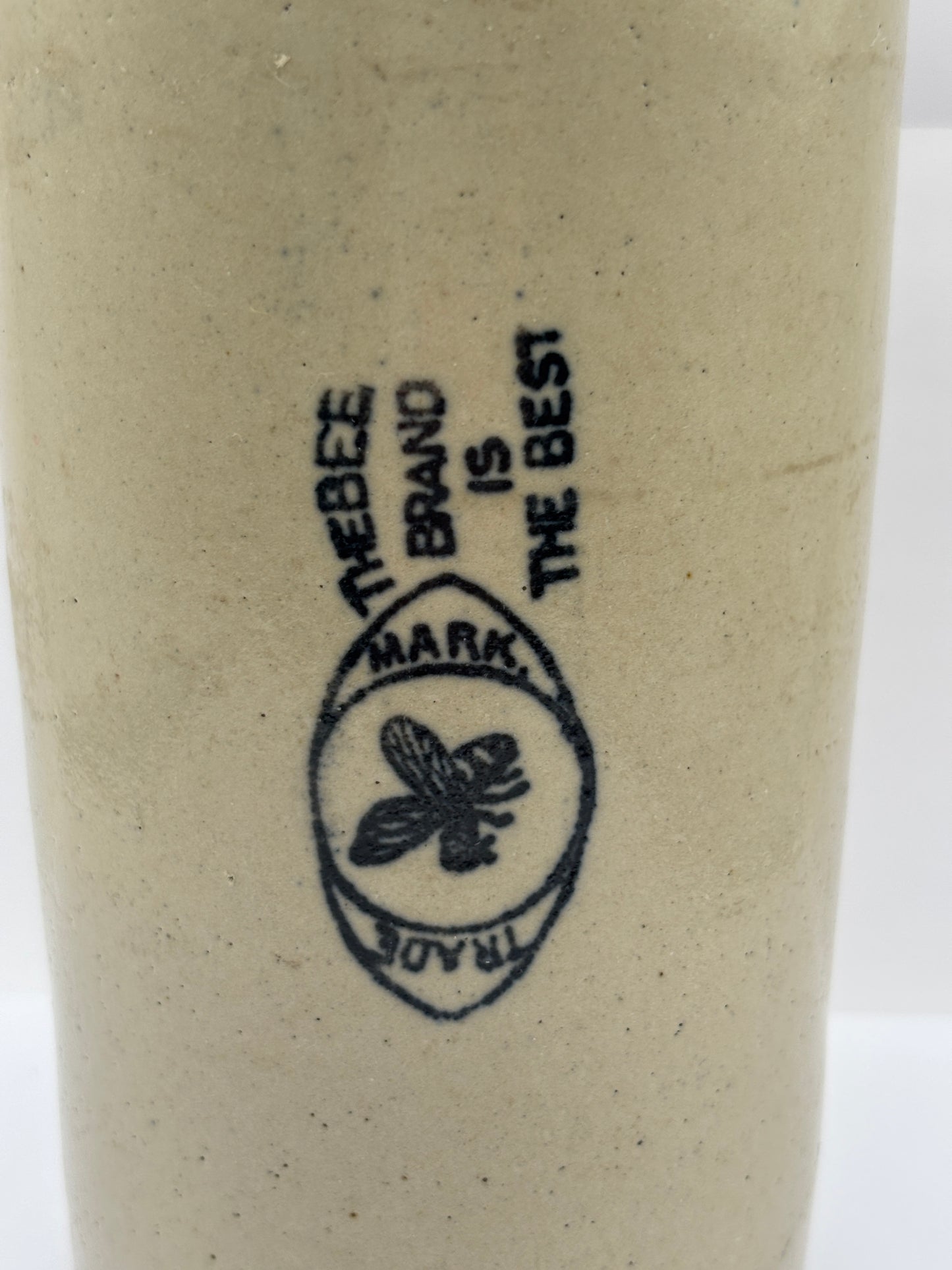 Old large advertising stoneware bottle. Bee brand