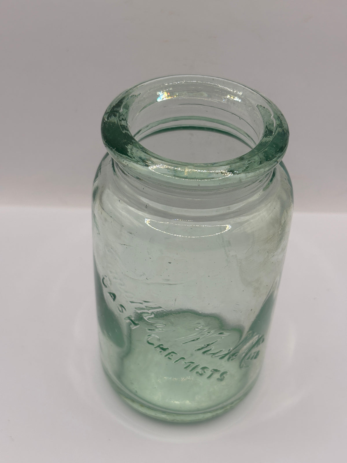 Old advertising aqua glass jar, Timothy Whites cash chemists