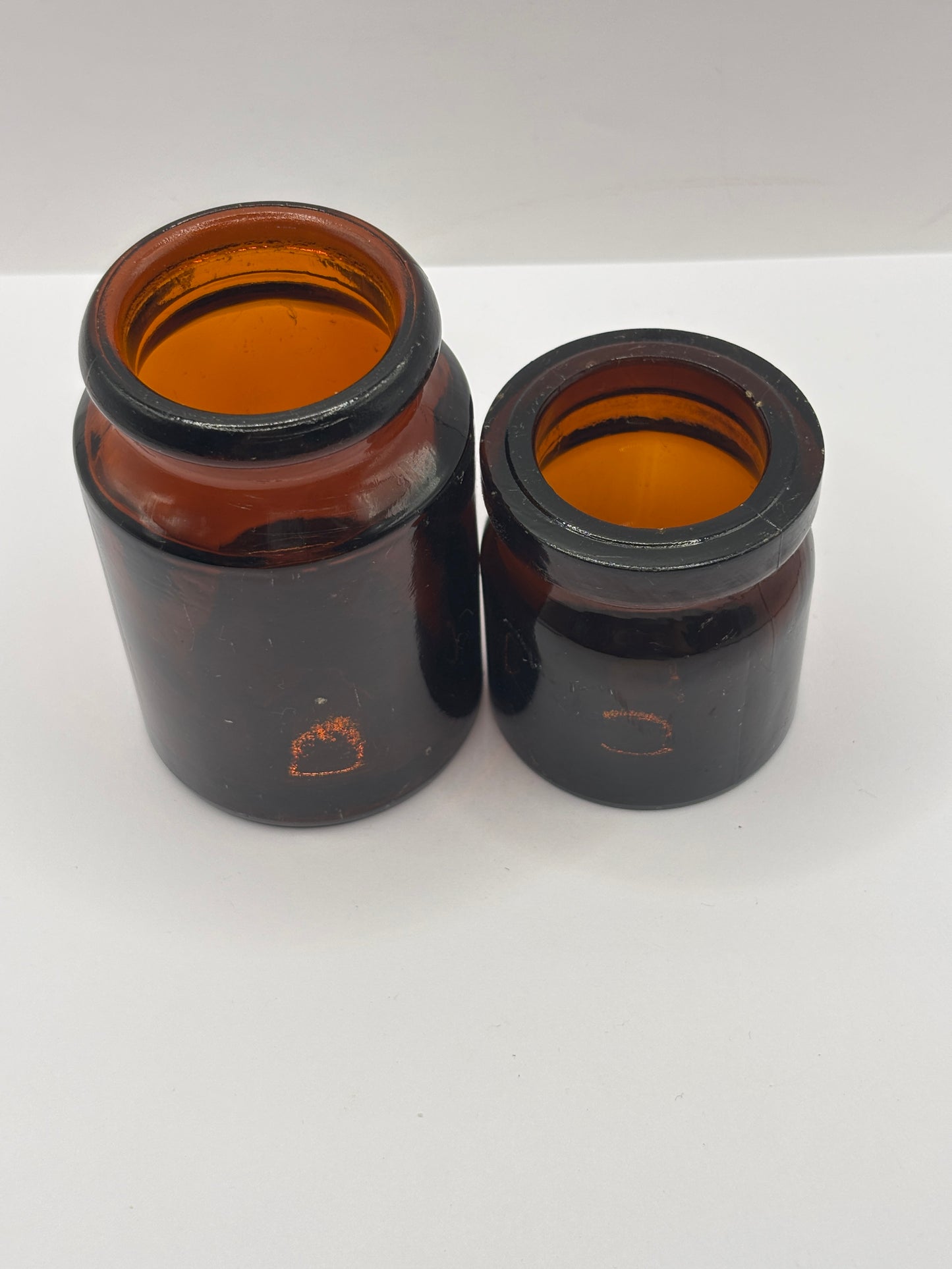 2 old amber glass jars