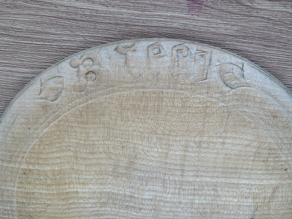 Old wooden carved bread board