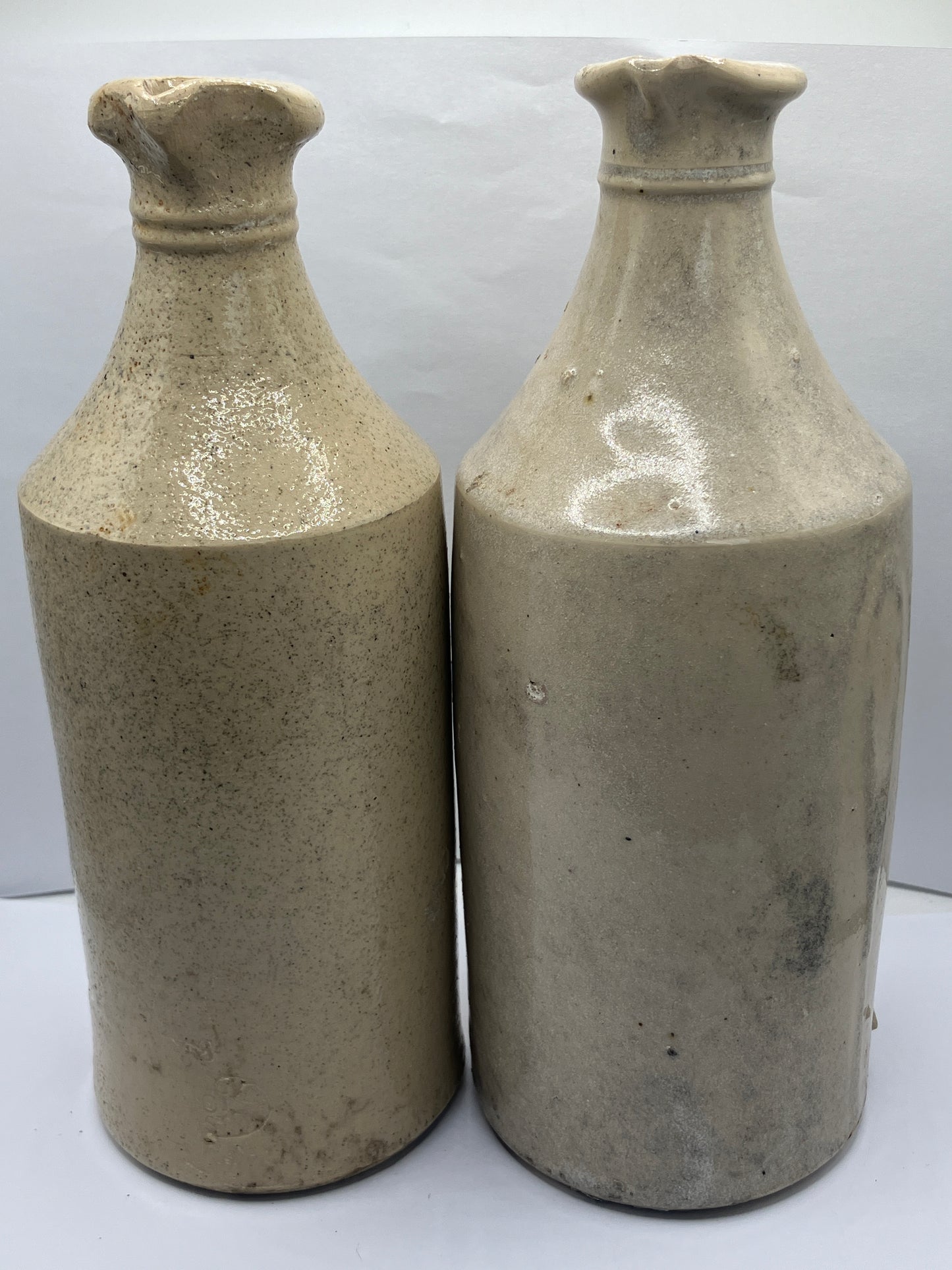 2 tall white stoneware pouring ink bottles