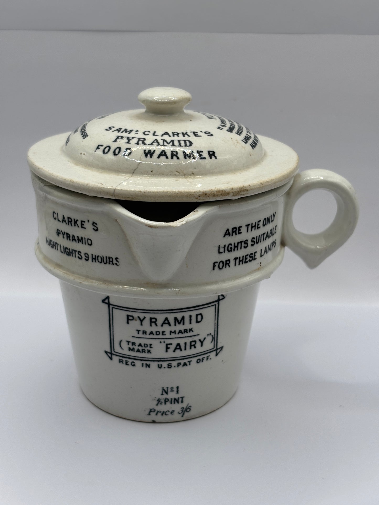 Old stoneware advertising food warmer. Clarkes Pyramid food warmer. Damaged/repaired