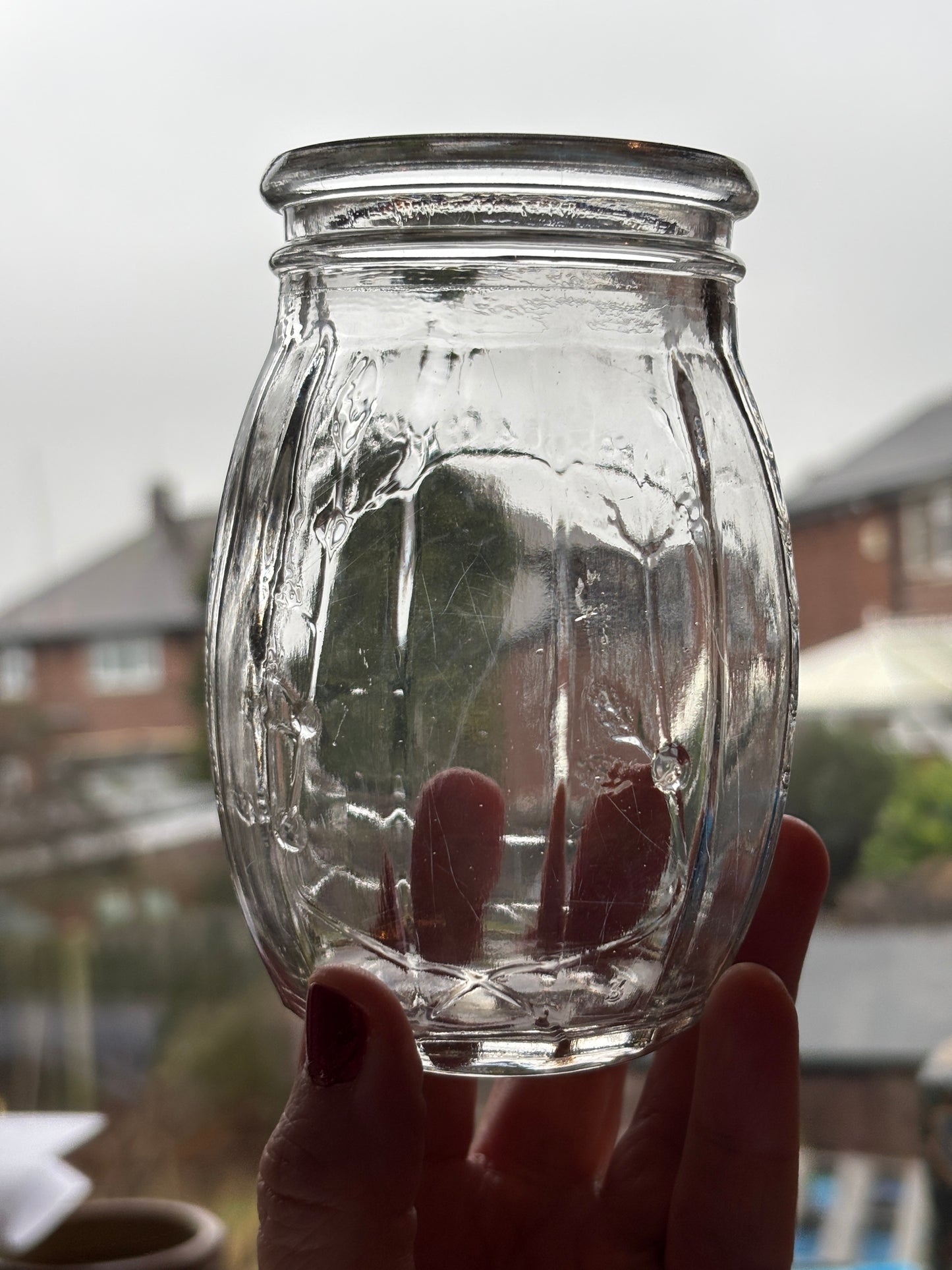 Old clear glass jar, Roses