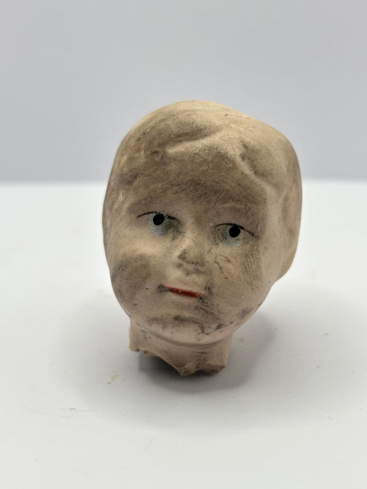 Old damaged dolls head