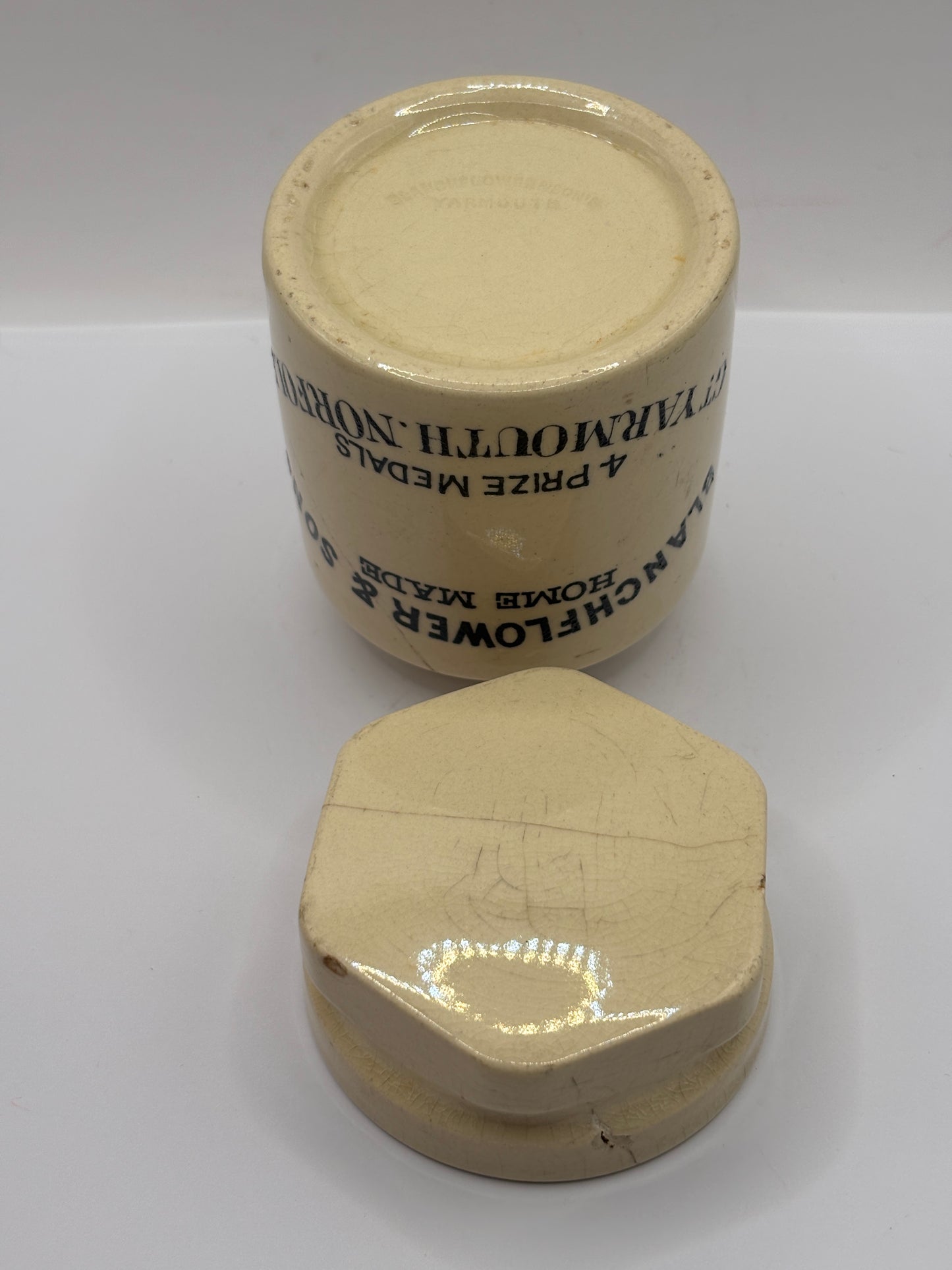 Old stoneware potted meat jar and lid. Blanchflower. Damaged