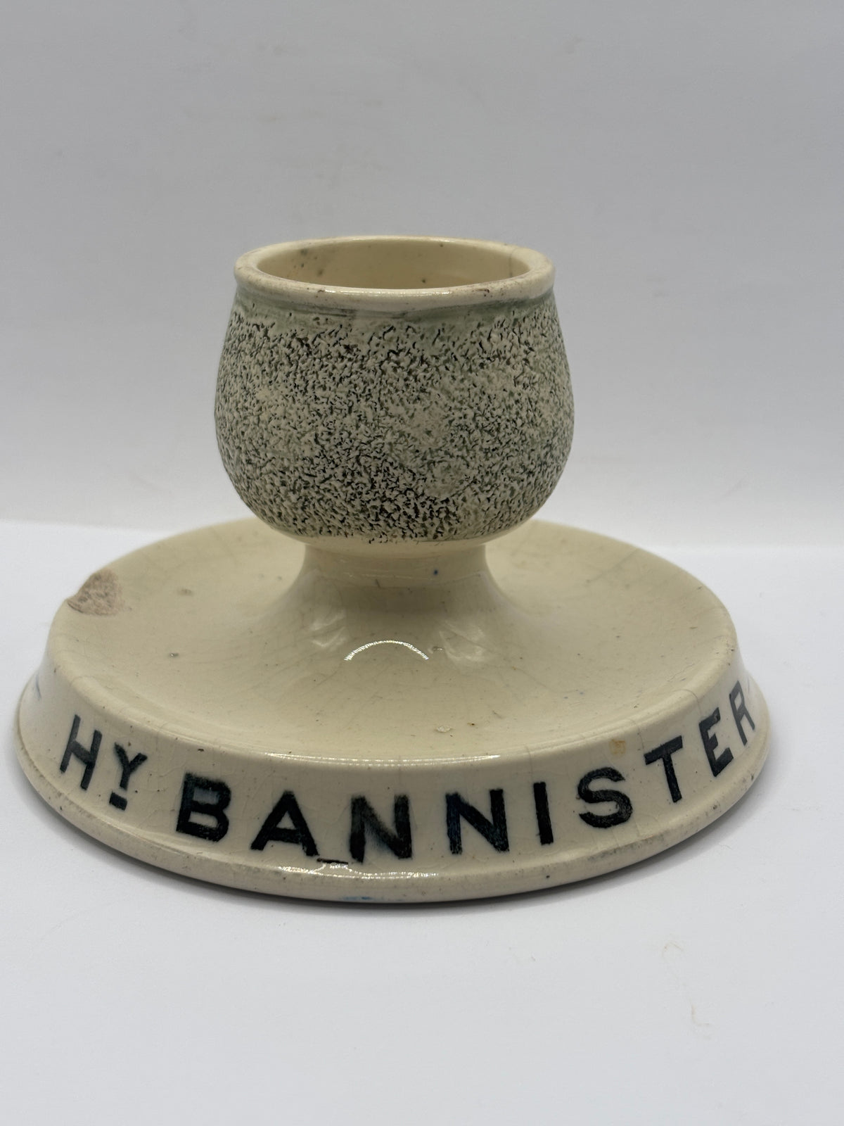 Old advertising stoneware match striker. HY Bannister Manchester