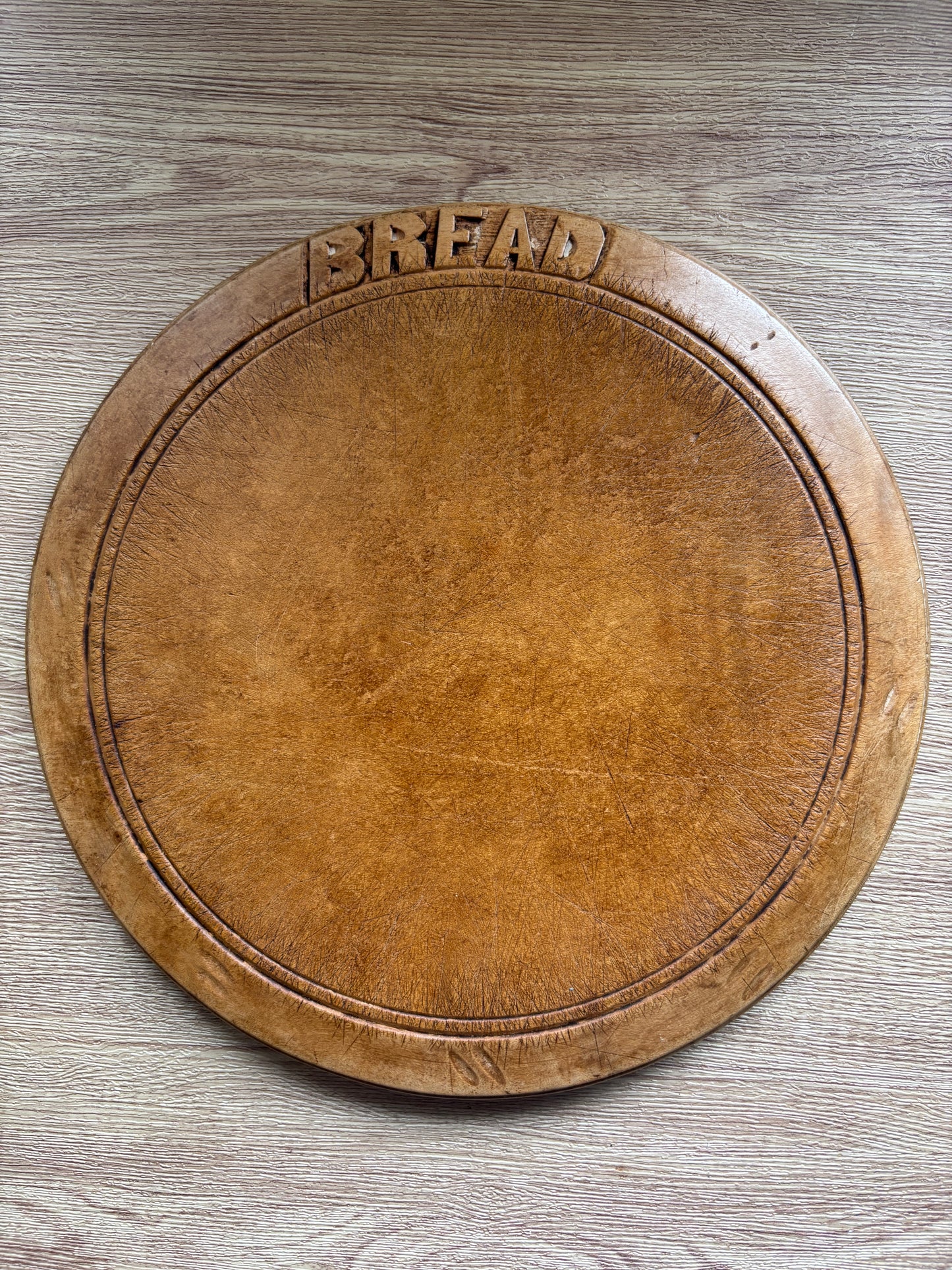 Old wooden carved bread board