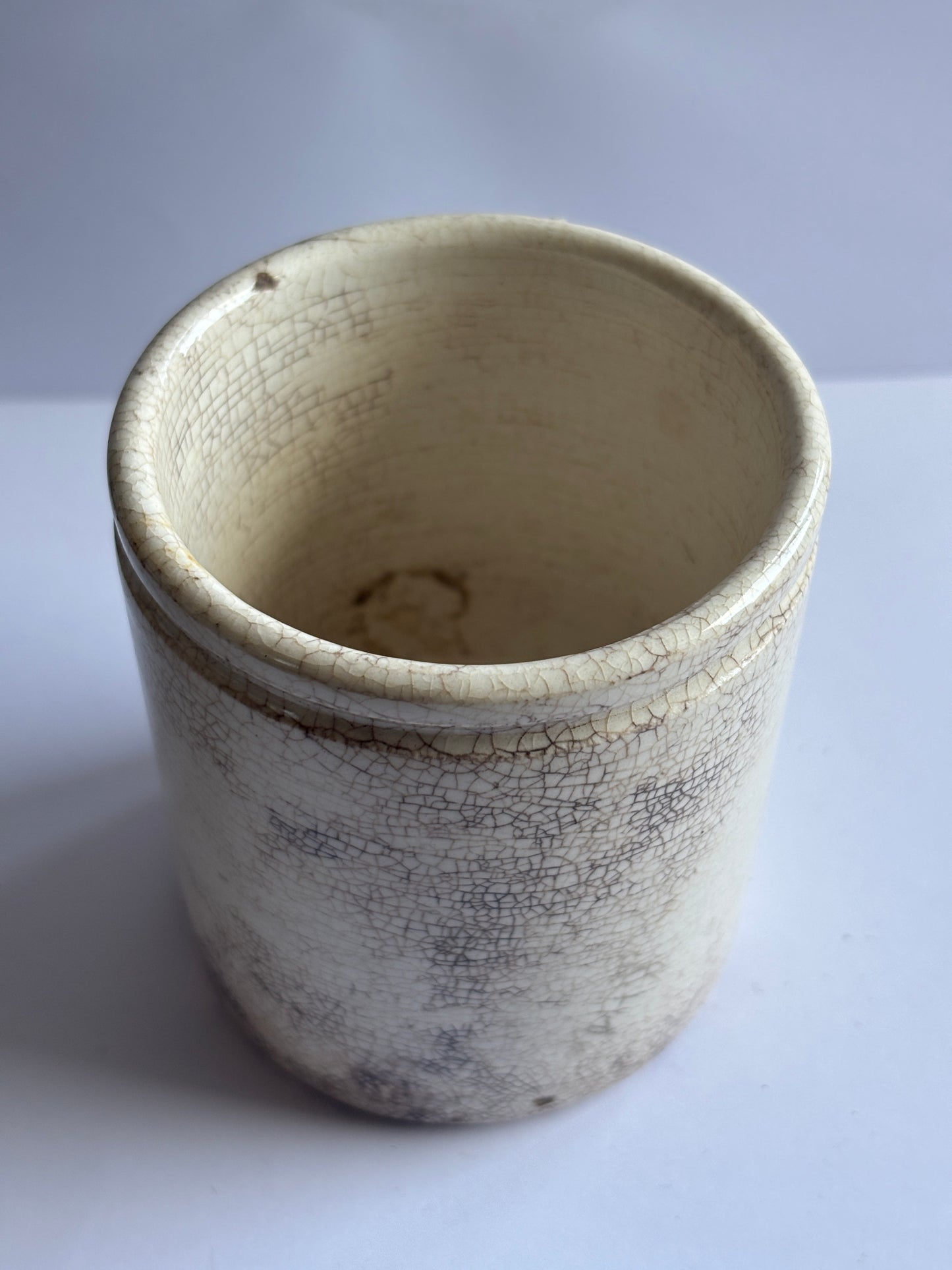 Old white stoneware pot, stained & crazed