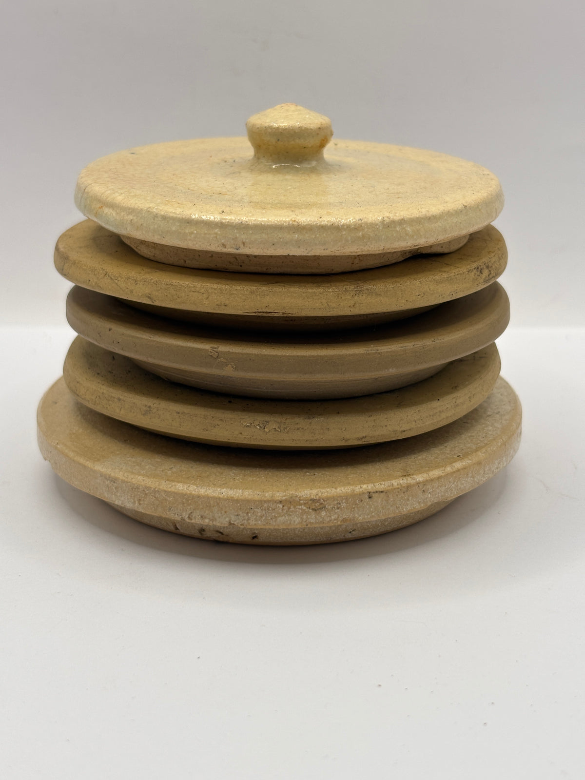 5 old stoneware lids, stackers
