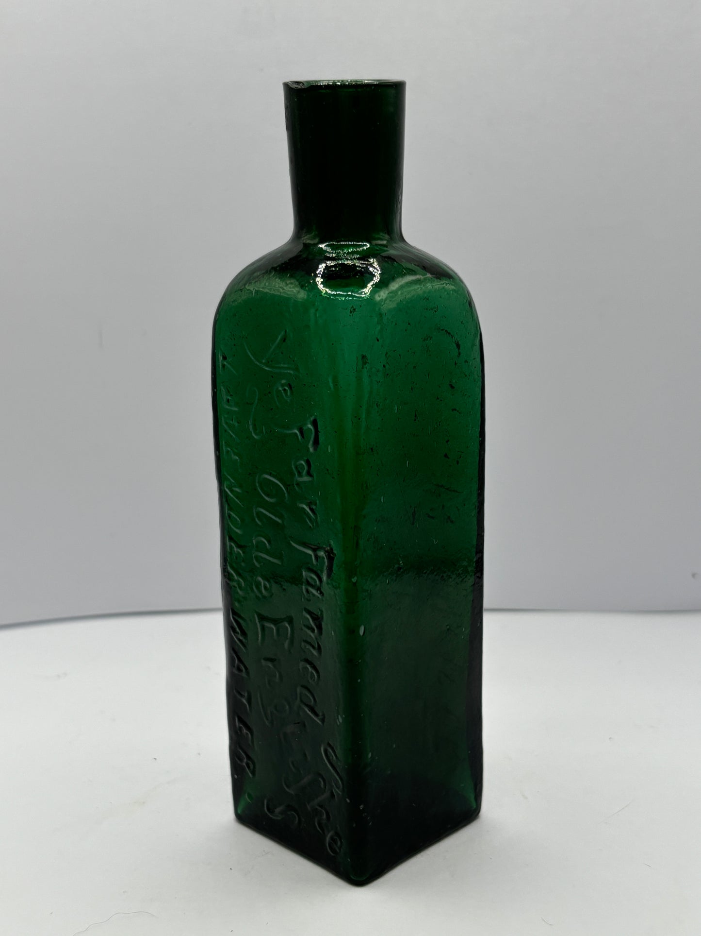 Old green advertising lavender water bottle, Ye far famed olde english lavender water