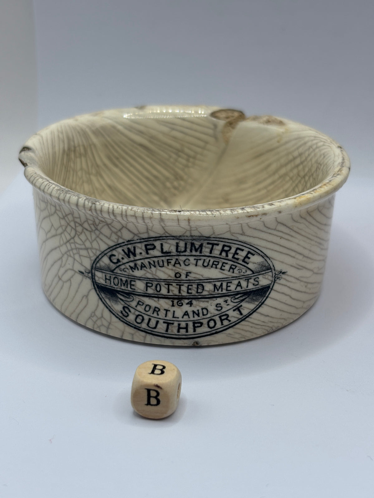 Old advertising meat paste pot, Plumtree home potted meats. Damaged (B)